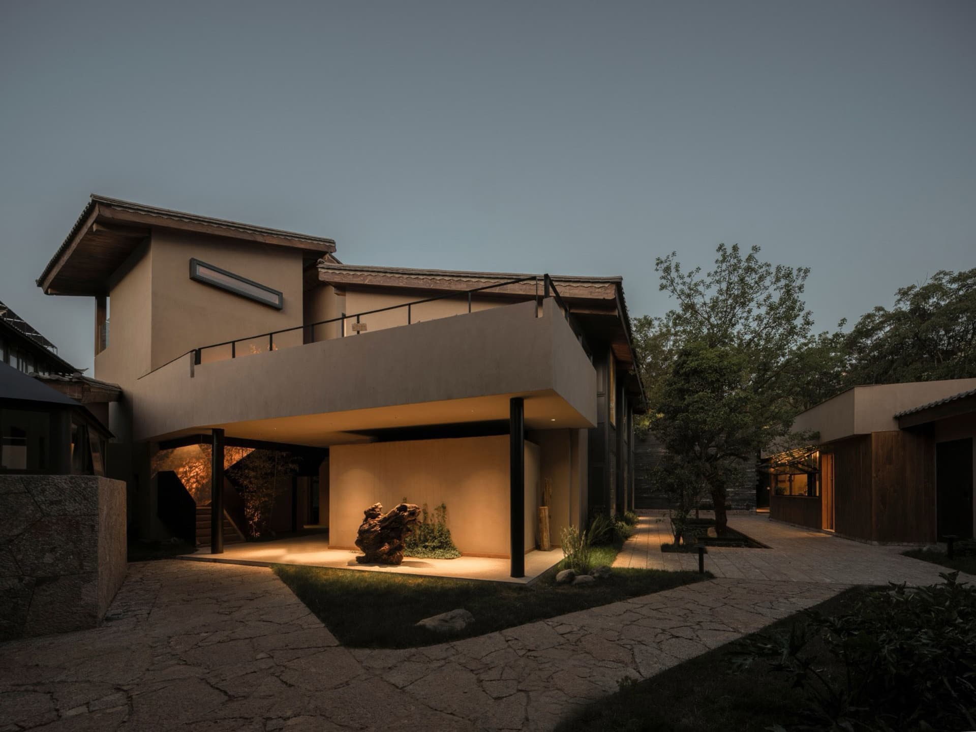 Modern residential exterior showcasing concrete and glass materials