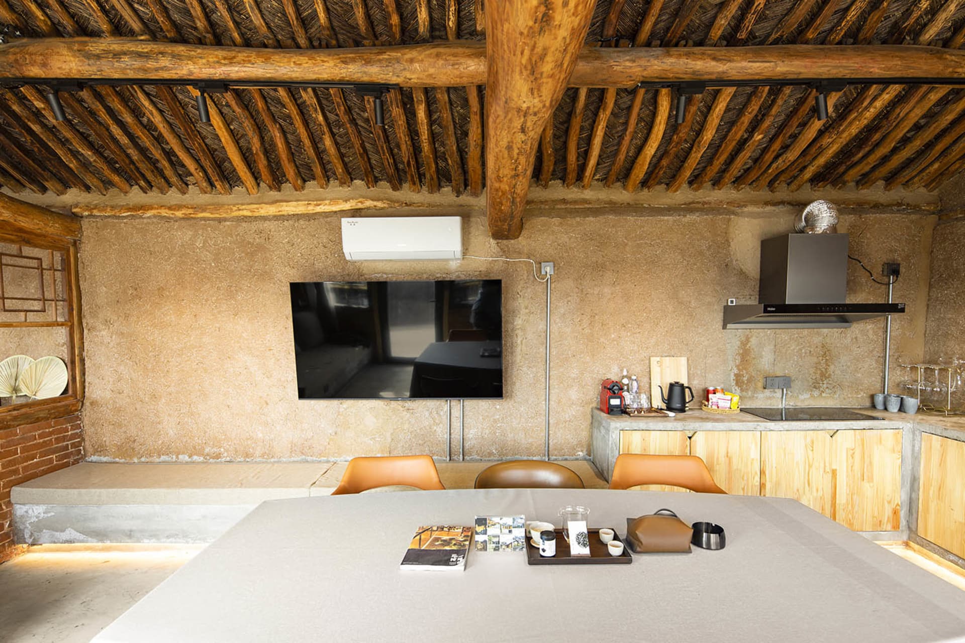Clean, minimalist interior design featuring concrete and wood materials.