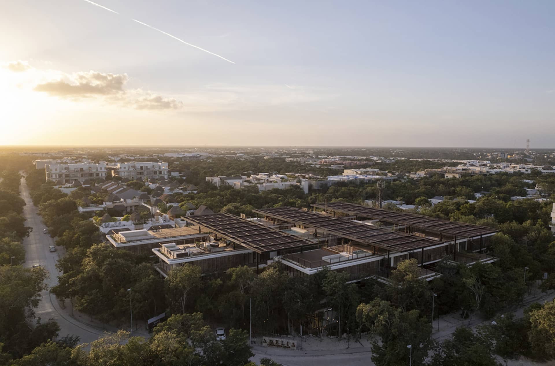 An aerial view of a modern residential development with metal and glass structures.