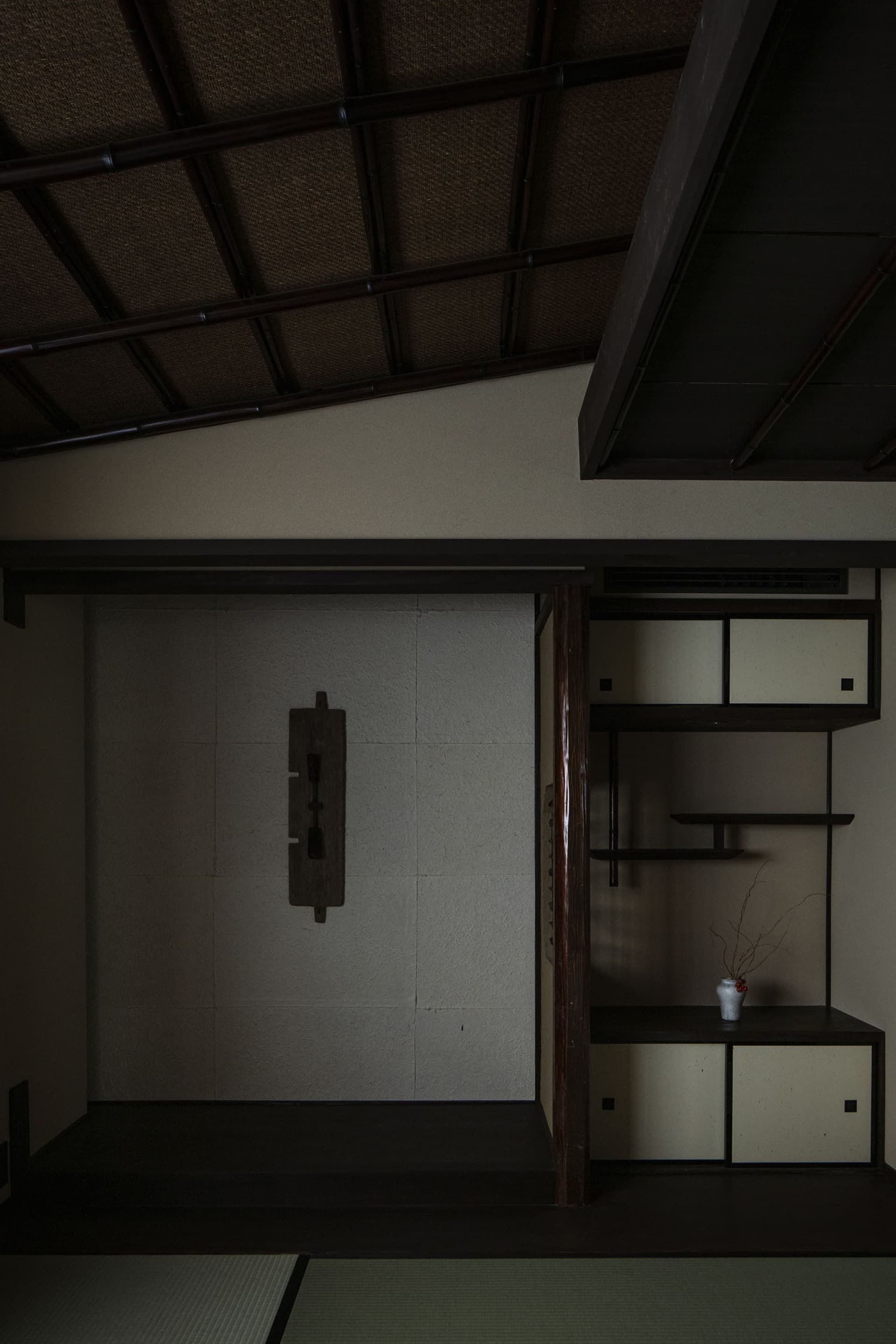 A modern interior with a wooden closet featuring a traditional Japanese design.