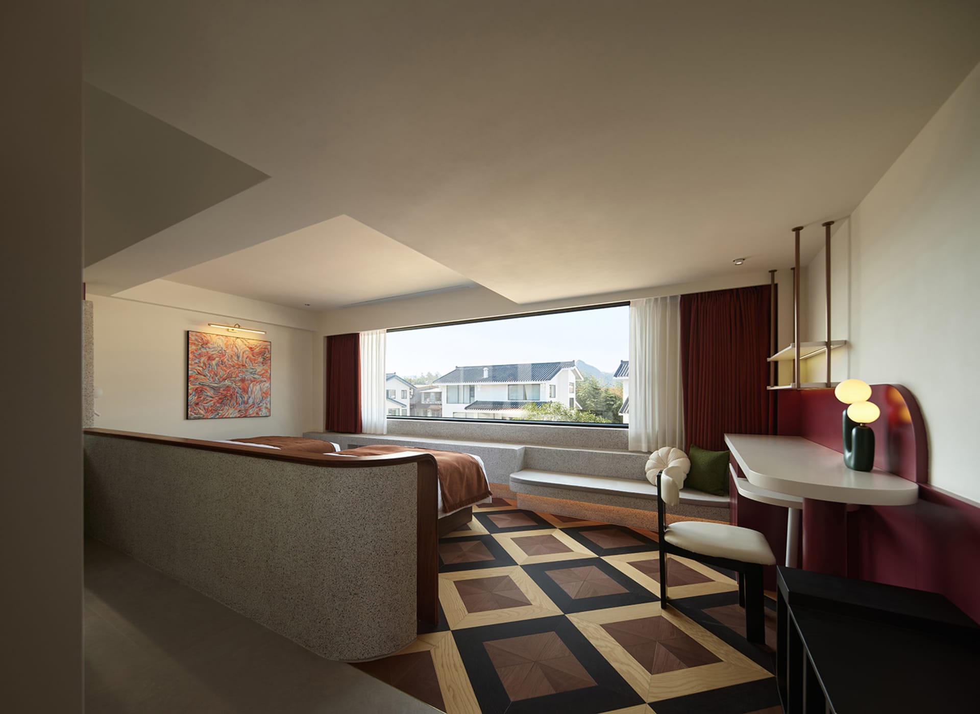 Modern residential space featuring a terrazzo floor and red curtains.