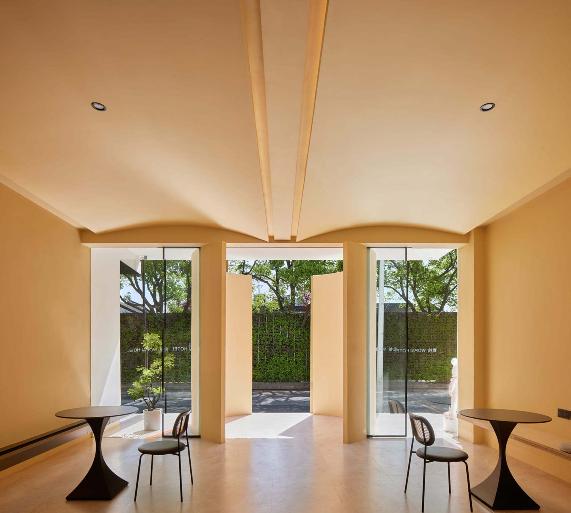 A modern cafeteria with tile flooring and glass walls and doors