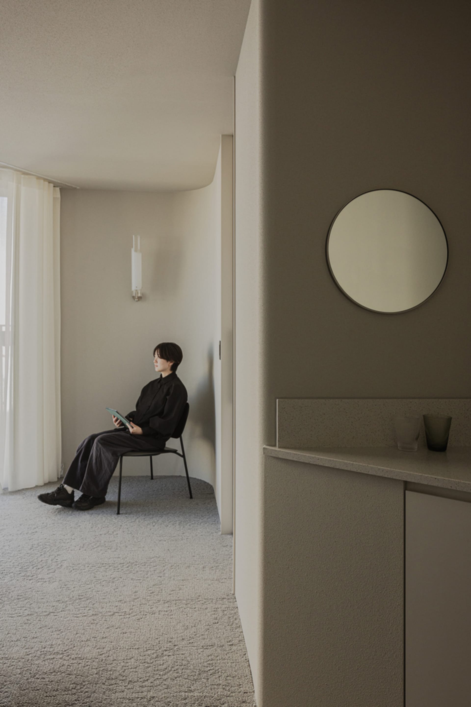 Minimalist living room with concrete and glass materials