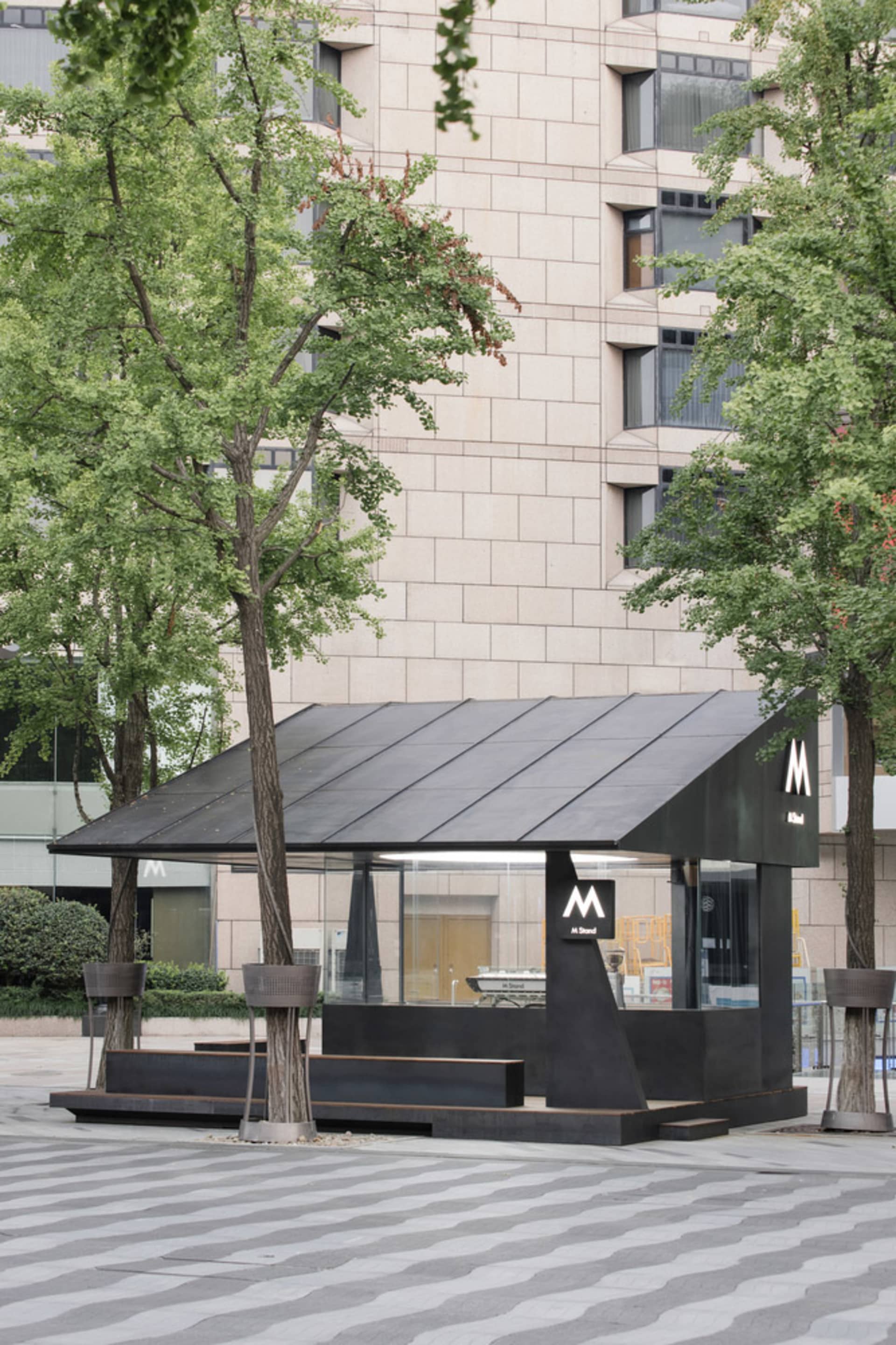 A minimalist retail storefront with a black and white color scheme.