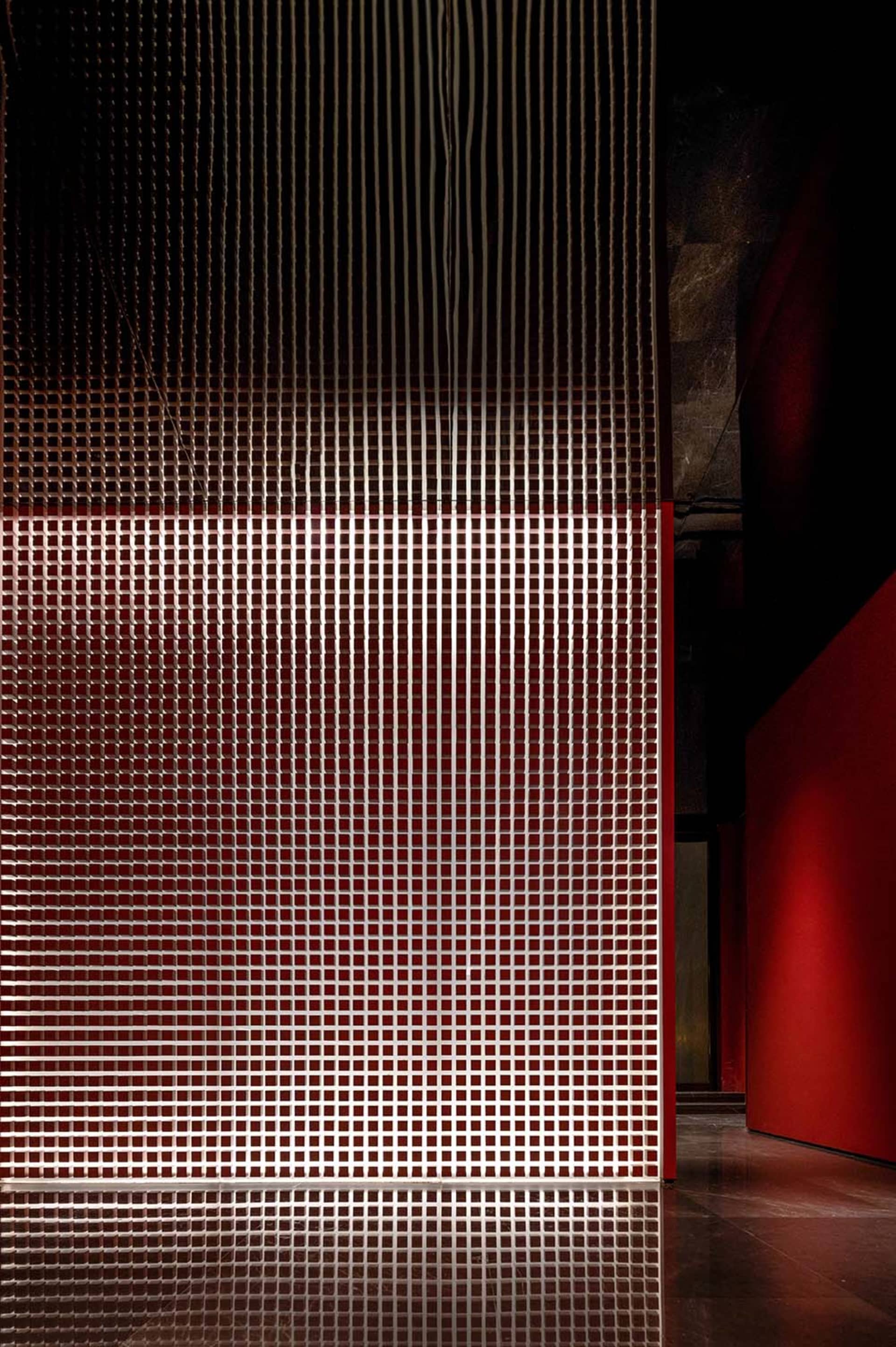 Modern interior design featuring metallic grid walls.