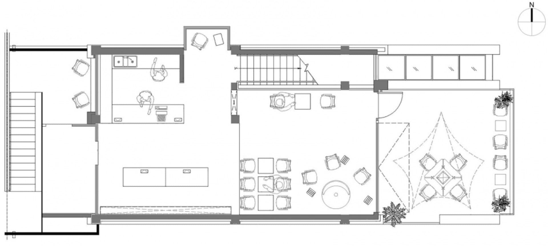 Floor plan of a modern restaurant featuring concrete, glass, and metal materials.