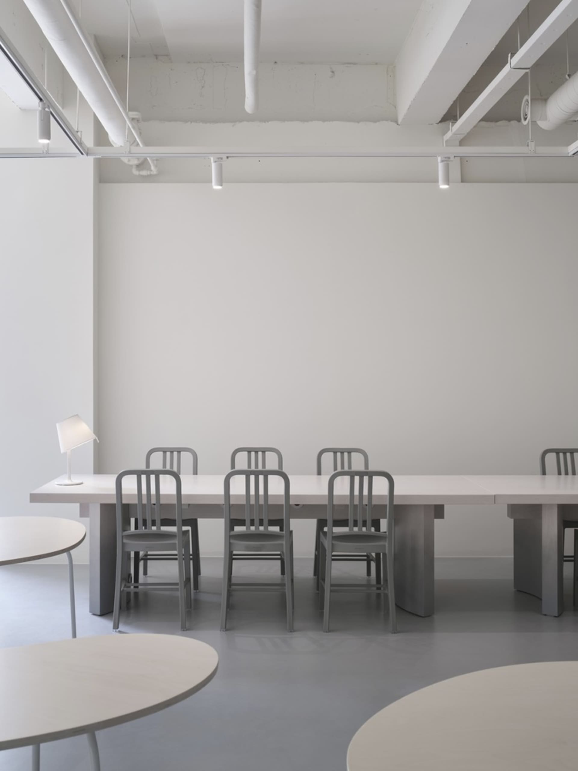 Modern conference room with steel and concrete furniture and floors