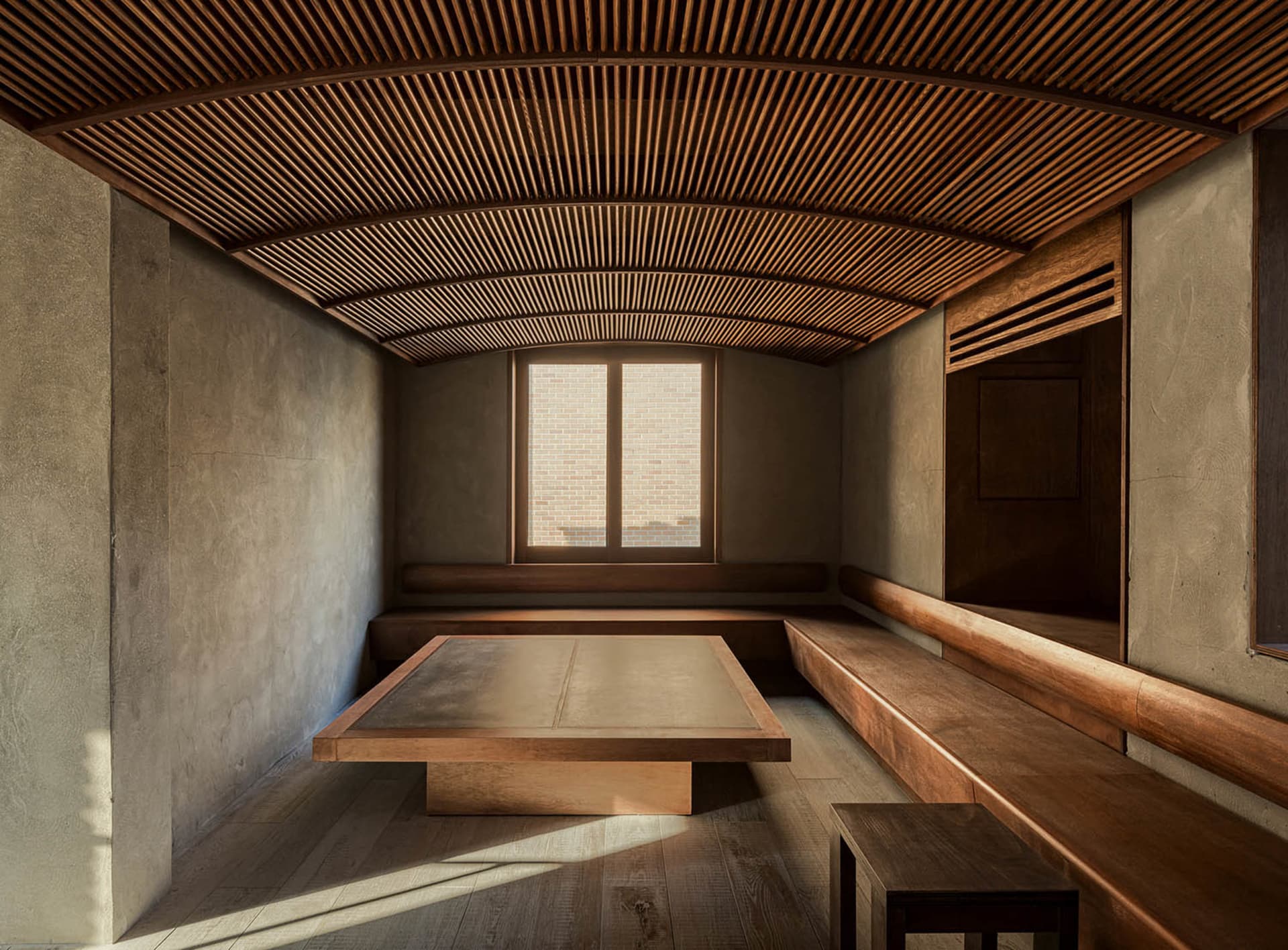 A minimalist interior space featuring wooden elements.