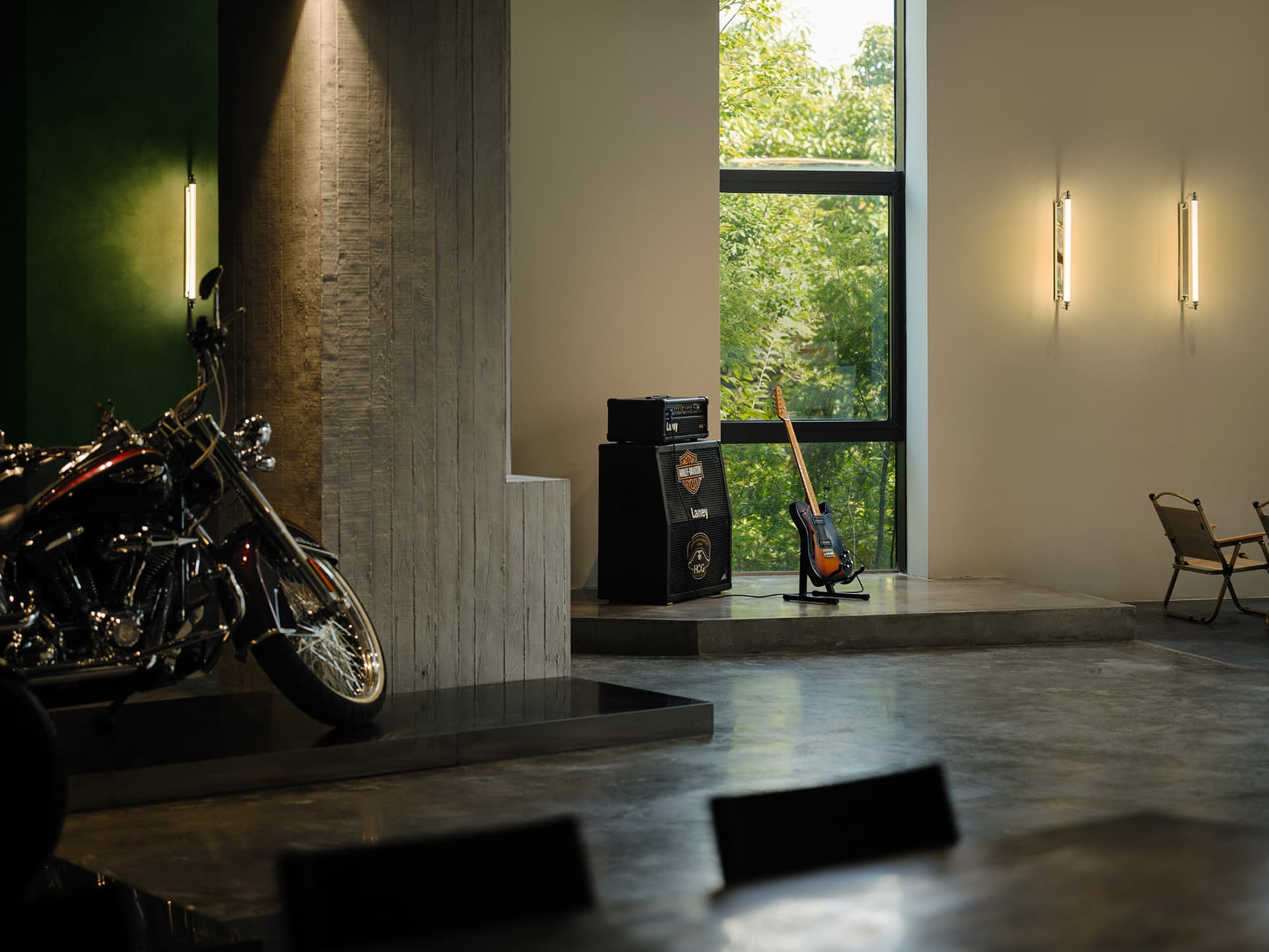 Industrially designed living room featuring concrete flooring and wooden elements