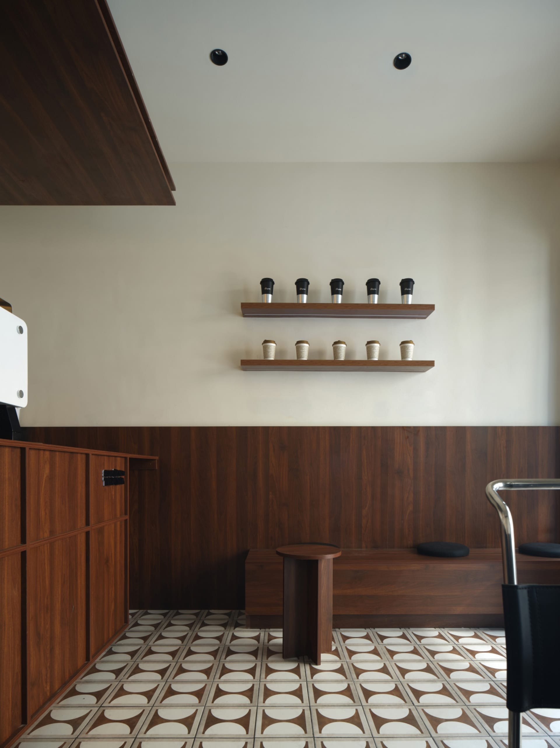 Modern coffee shop interior with wooden elements and white tiles