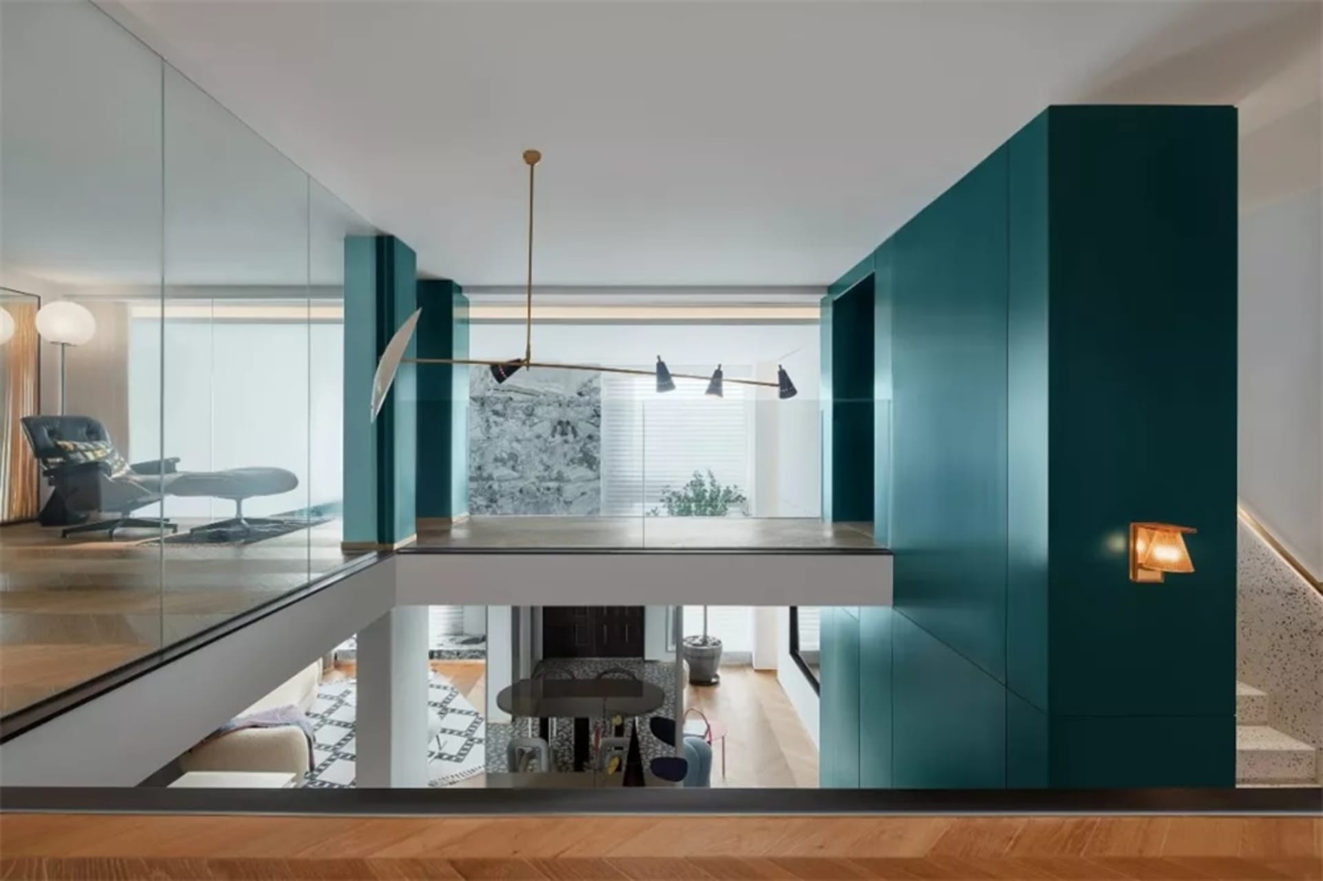 A modern living room featuring glass walls, a minimalist design, and sleek furniture.