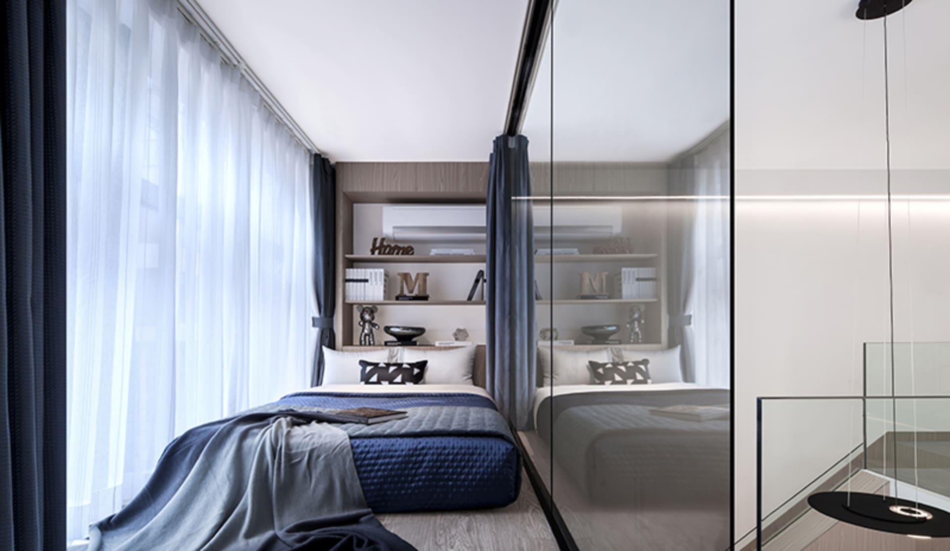 Modern minimalist bedroom with blue fabric bedding, glass doors, and metal accents.