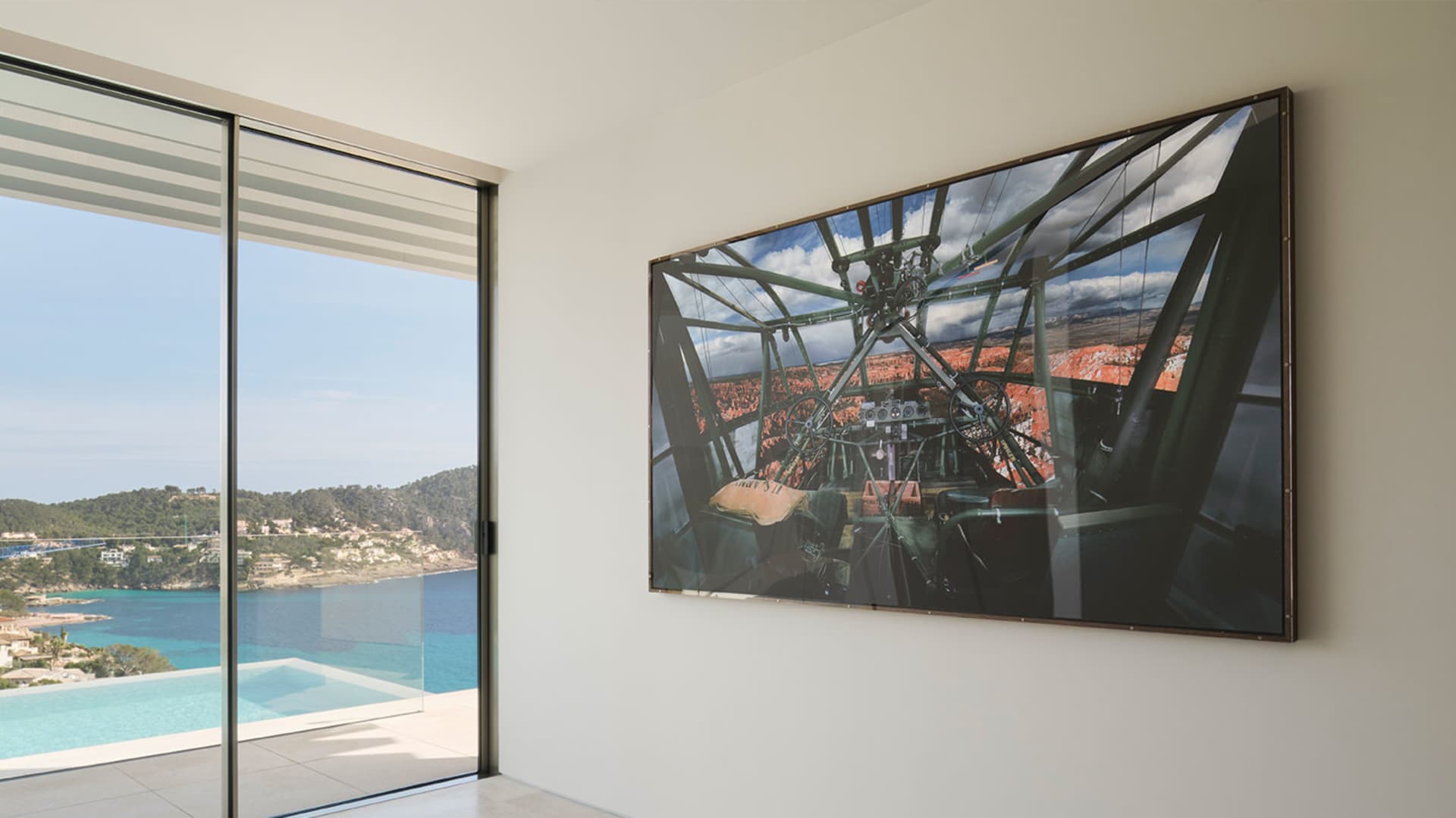 Modern interior with large glass windows and metallic accents.