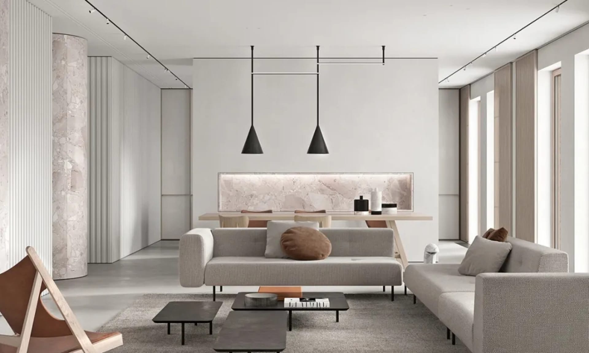 A modern minimalist living room with beige sofas, black coffee tables, and marble accents.