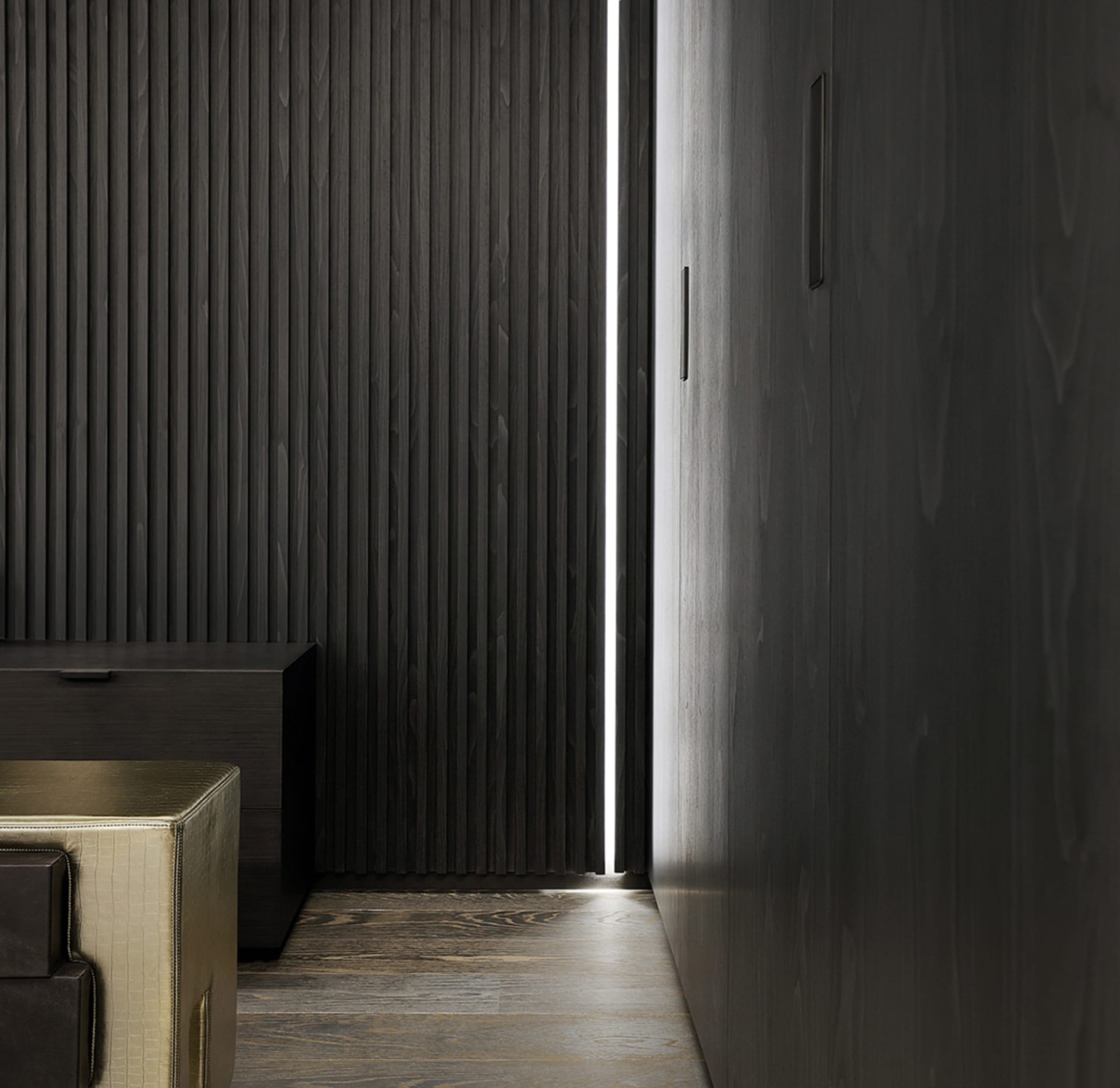 A modern interior space featuring dark wooden panels and minimalist design.