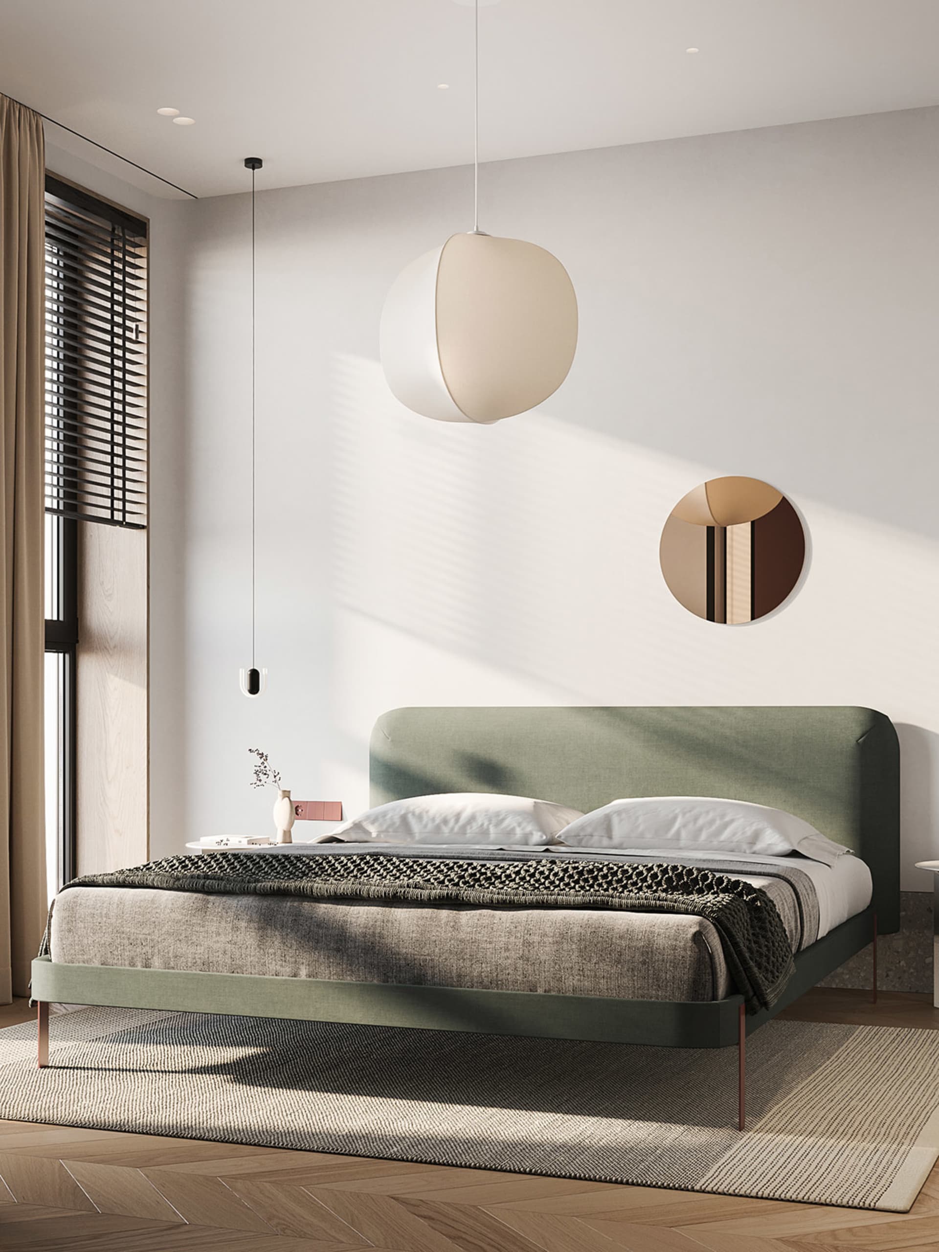 A modern minimalist bedroom featuring a fabric-covered bed in a light green color, with a geometric pendant light and a circu