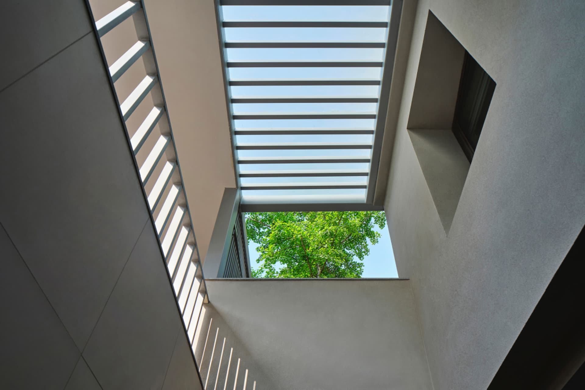Modern interior with glass wall and skylight