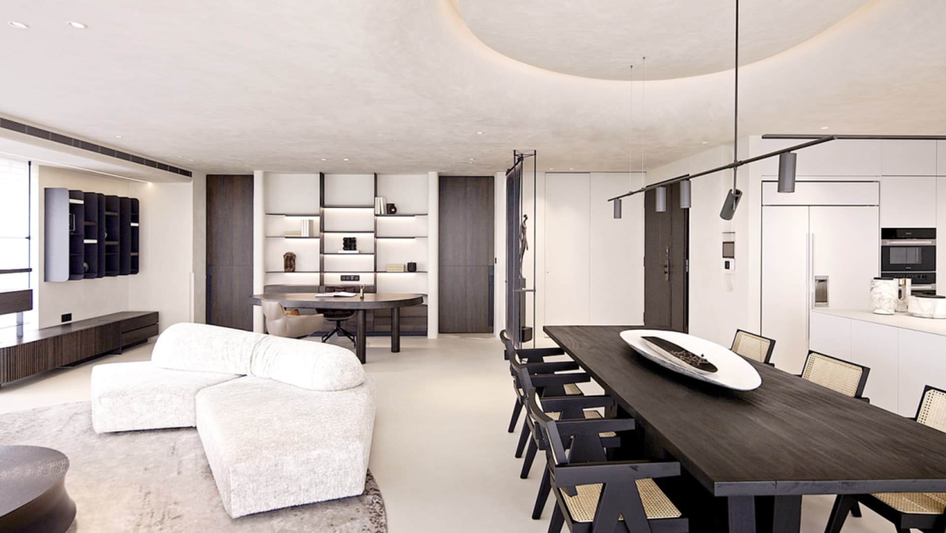 Modern minimalist living, dining, and kitchen space in a modern home with white and wooden finishes.