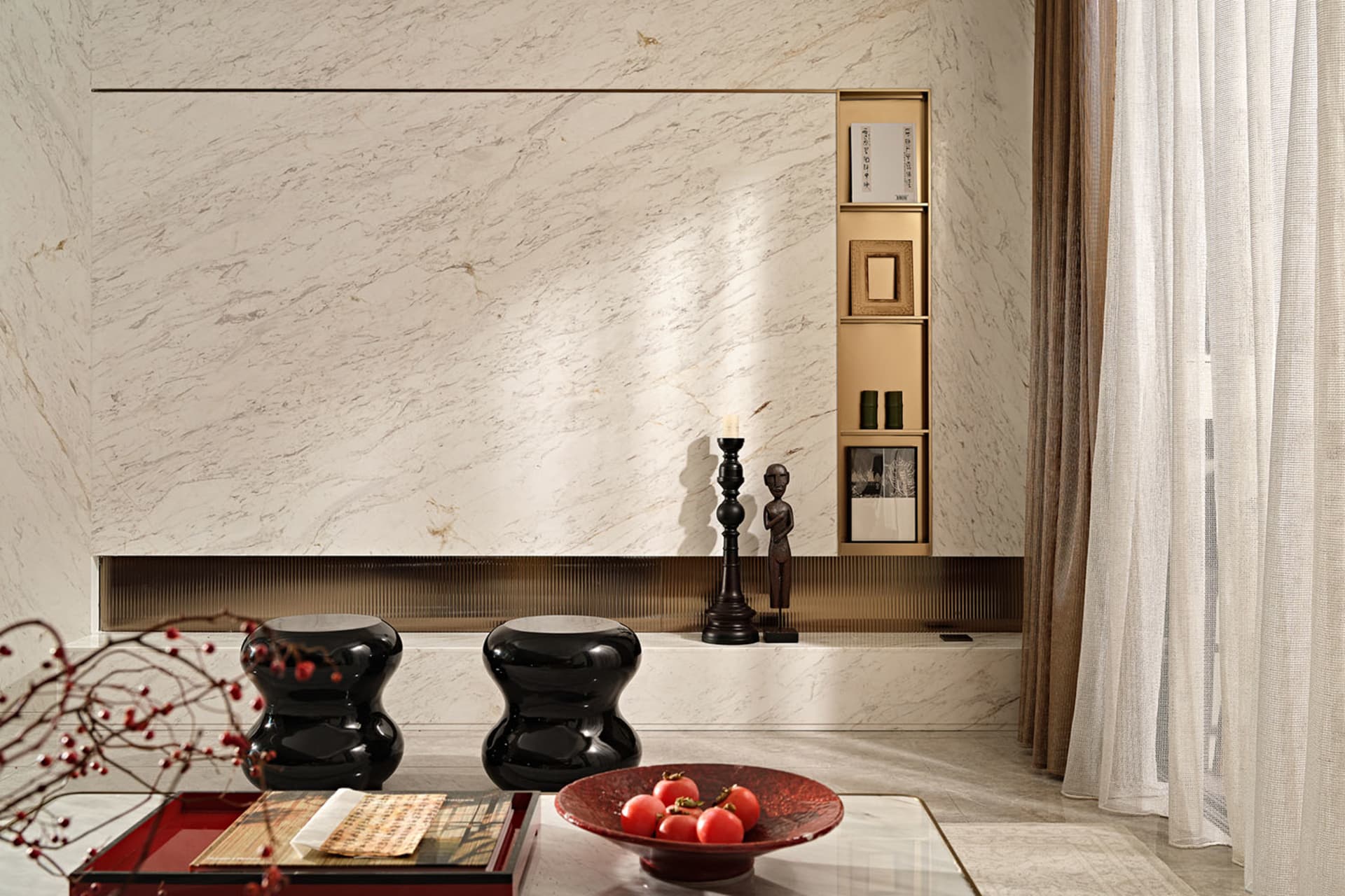 A modern minimalist living room featuring marble walls and glass elements.