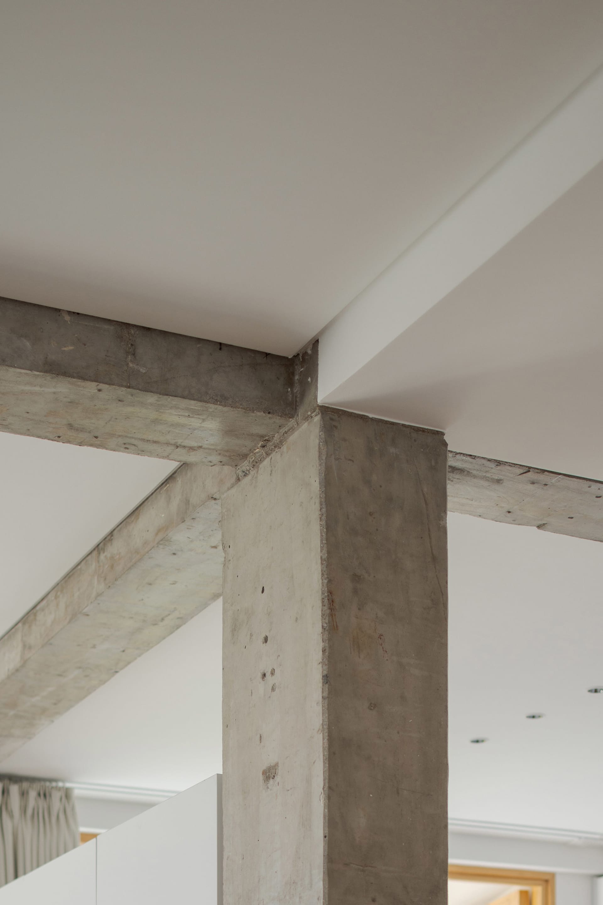 Modern interior space featuring a sturdy concrete support column
