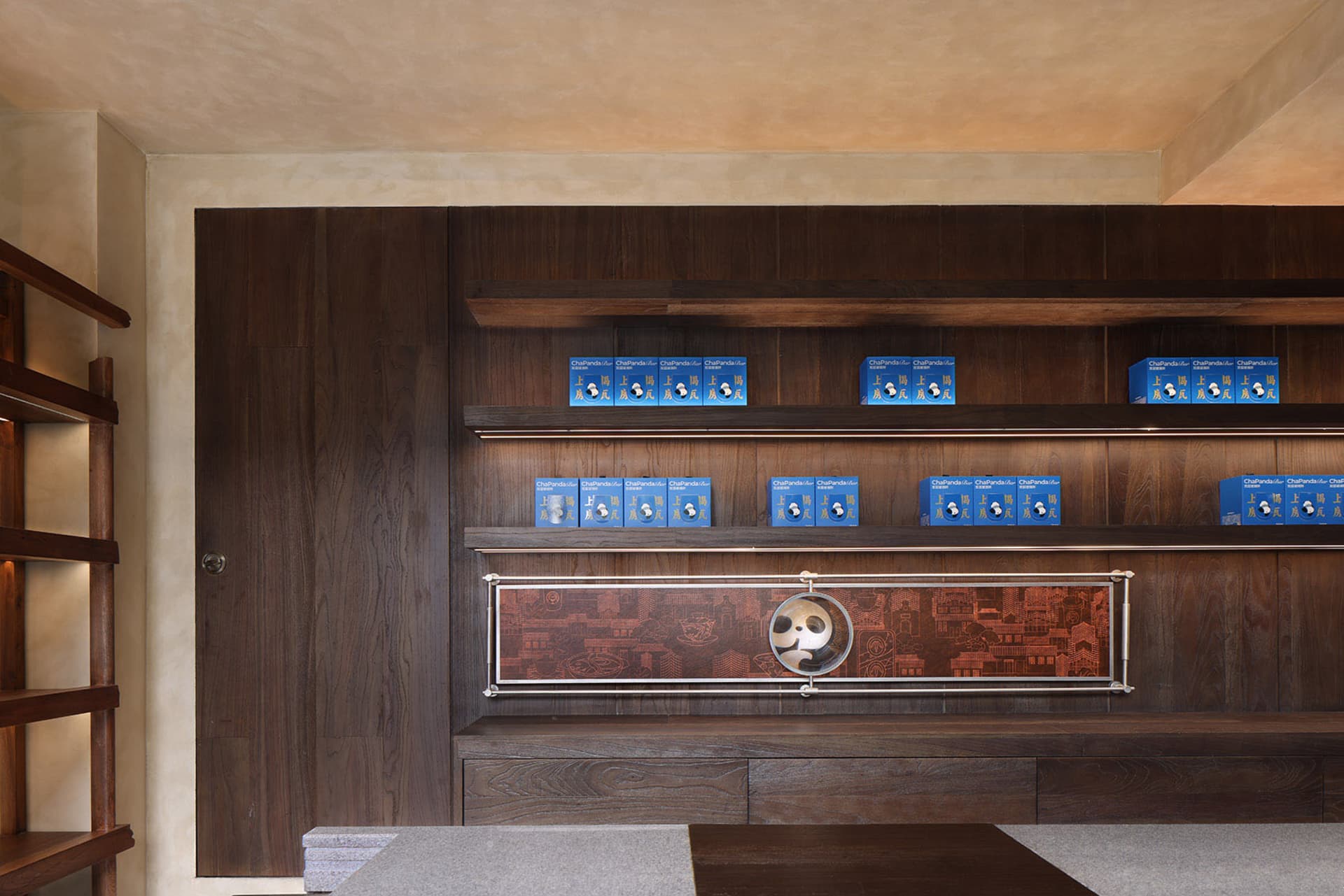 A wooden cabinet with variously sized books on its shelves, creating a cozy and organized living space for reading and relaxation