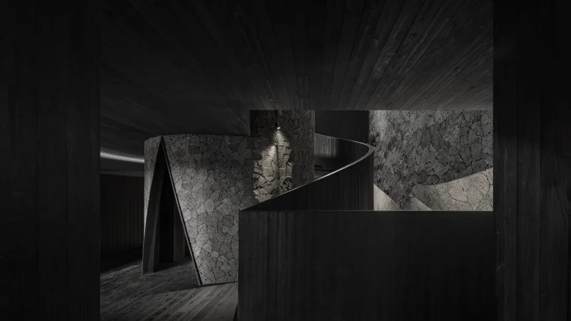 A dark and moody interior space with a spiral staircase featuring two sets of wooden stairs, creating a sense of depth and intrigue