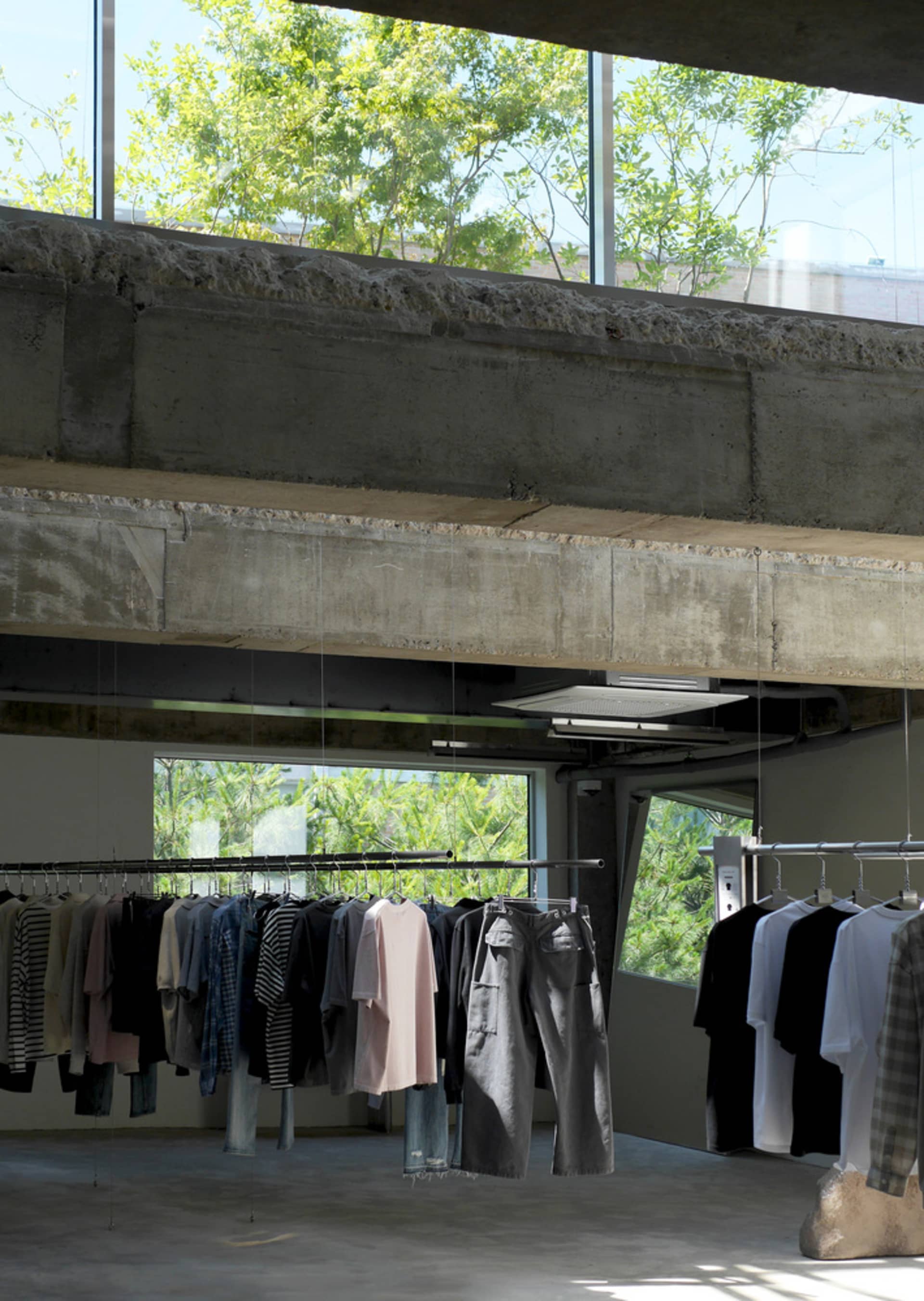 A well-organized clothing store with shirts on racks, creating a clean and inviting atmosphere