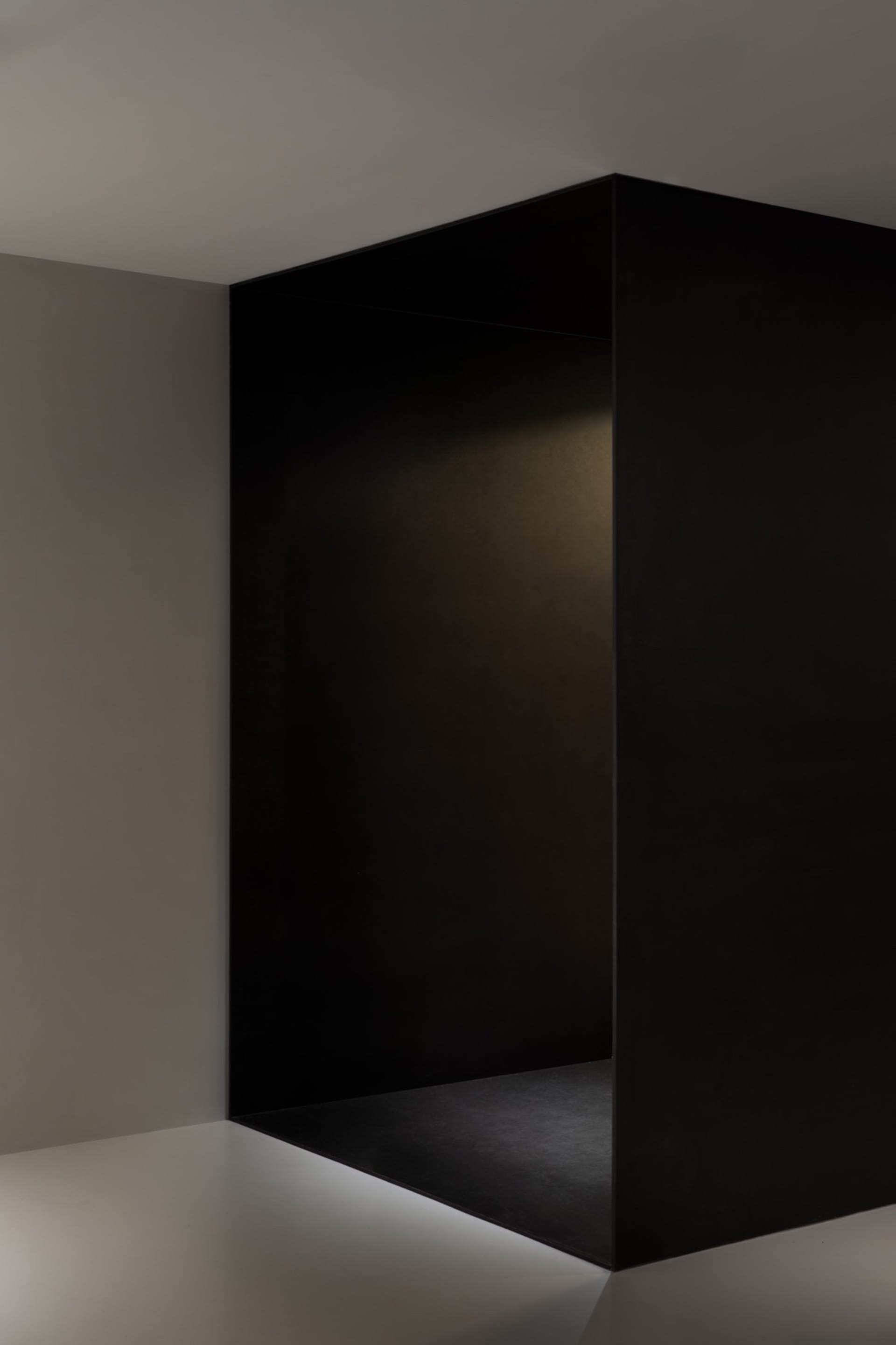 Empty modern hallway with black walls, a calm and quiet atmosphere, and a sense of anticipation
