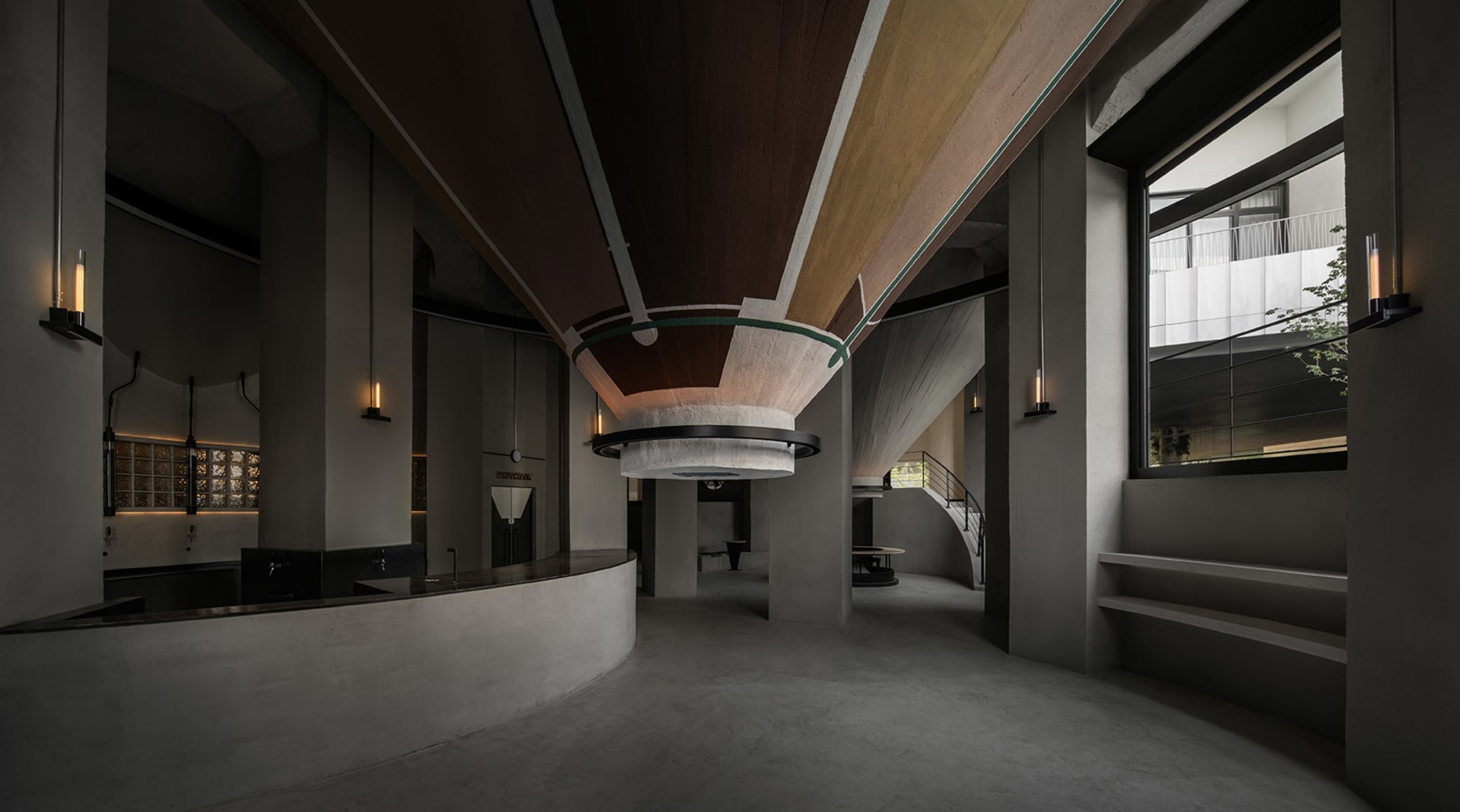A modern lobby with a circular wooden ceiling, multiple chairs, and two dining tables, creating a warm and inviting atmosphere