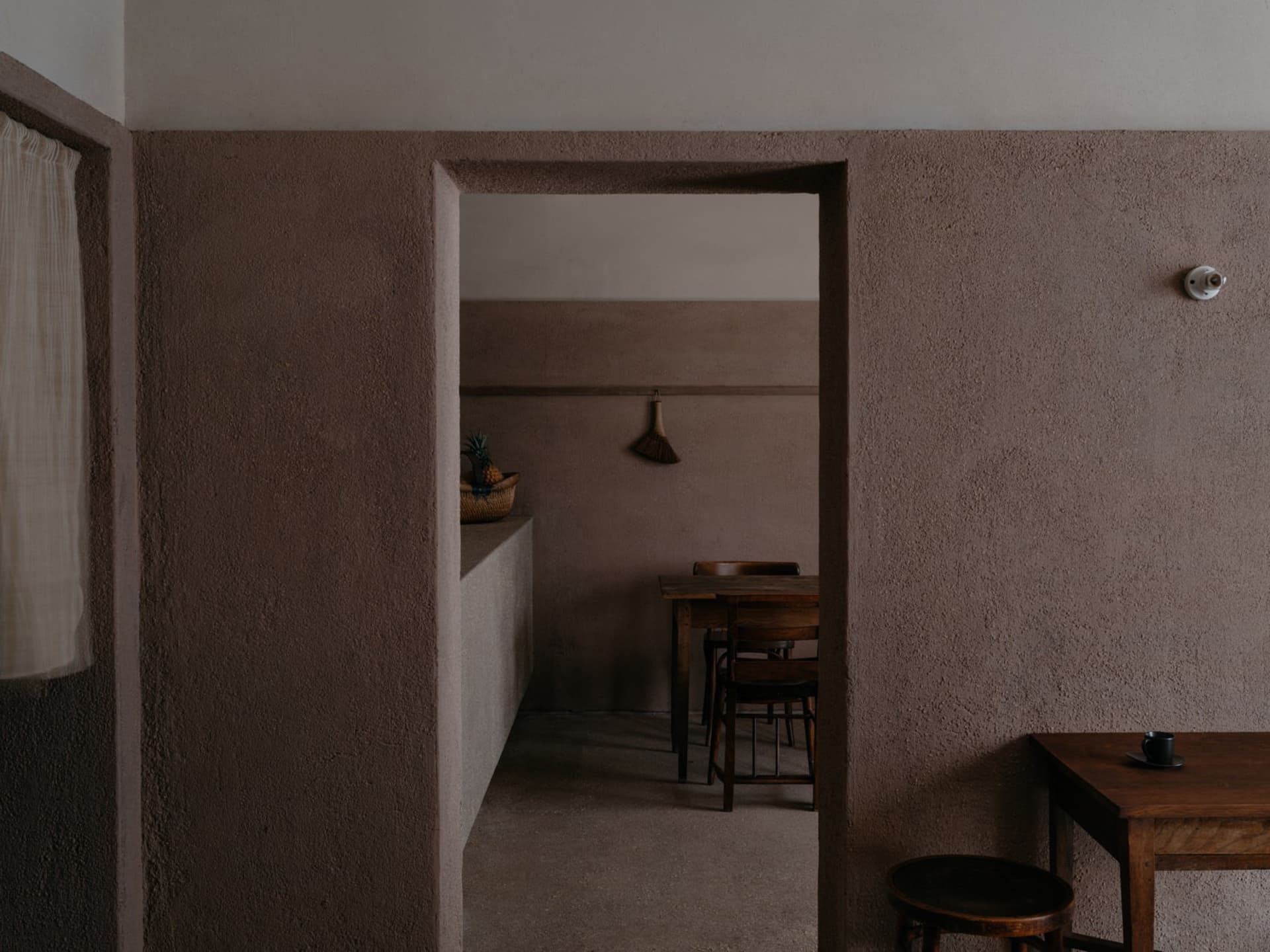Cozy dining space with stone walls, wooden furniture, and a warm atmosphere
