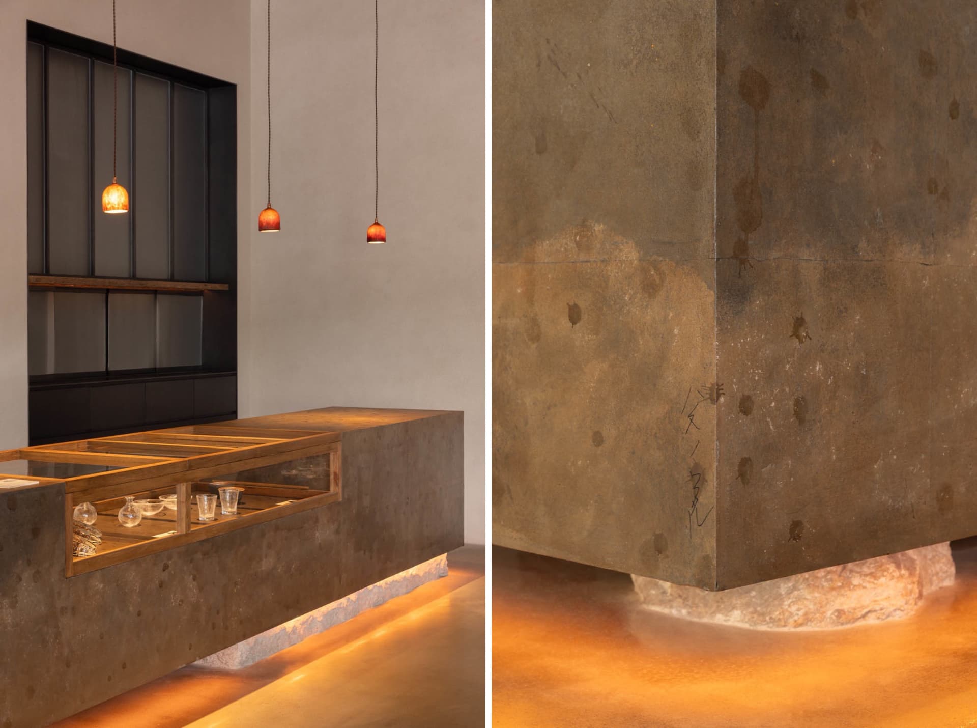 Industrial kitchen dining space with a countertop, sink, and dining table, illuminated by hanging lights