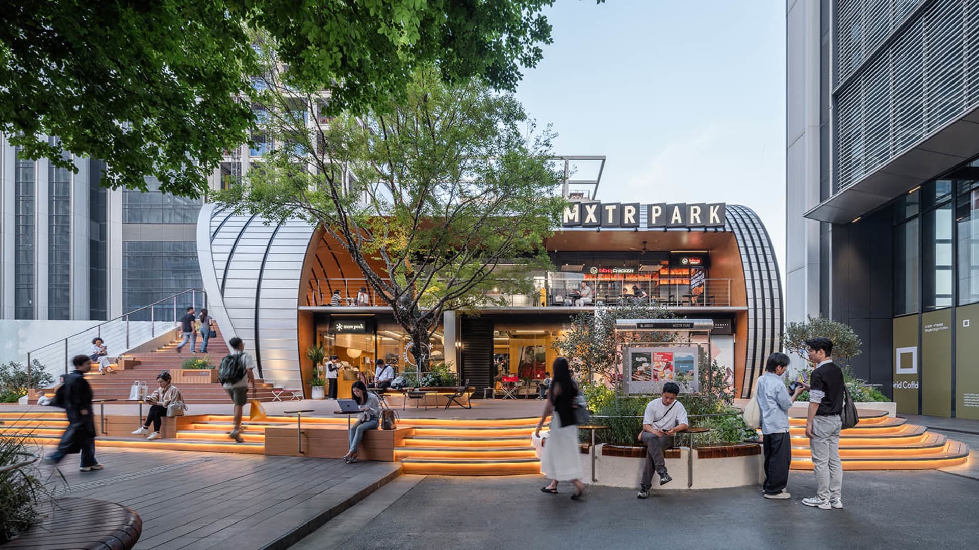 A bustling city street scene with various storefronts, pedestrians, and bicycles, set against a lively urban backdrop