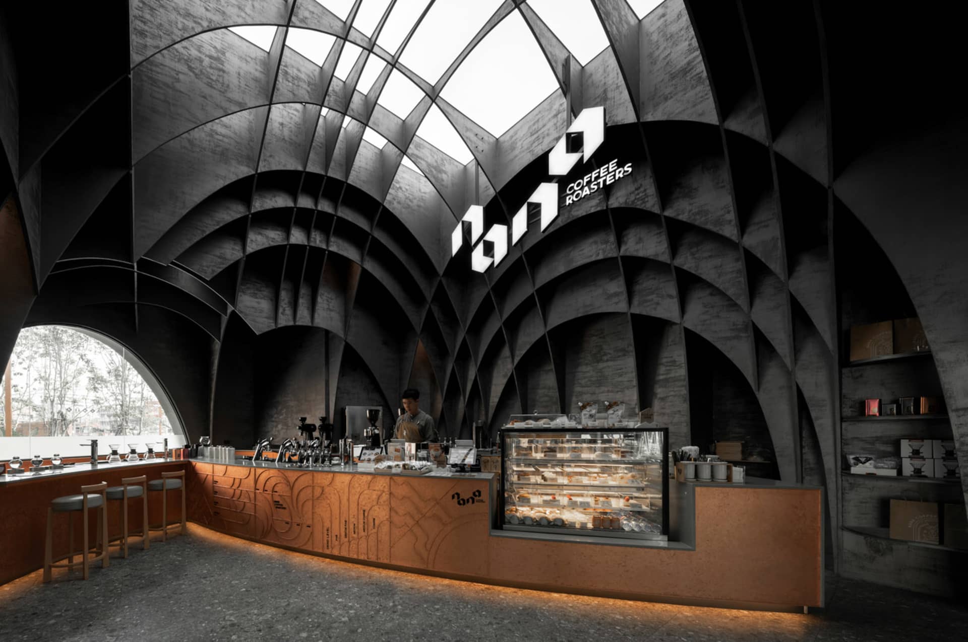 A modern coffee shop with a counter and dining area, featuring chairs and tables, and multiple cups on the counter