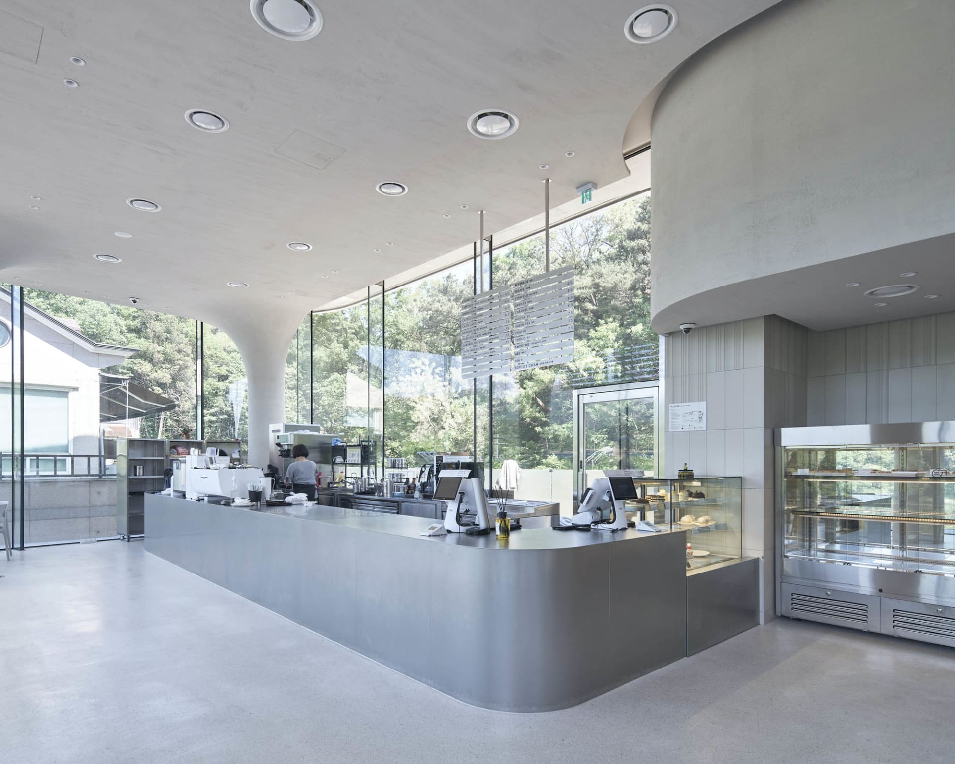 Casual open kitchen space with a large countertop, people present, and inviting atmosphere