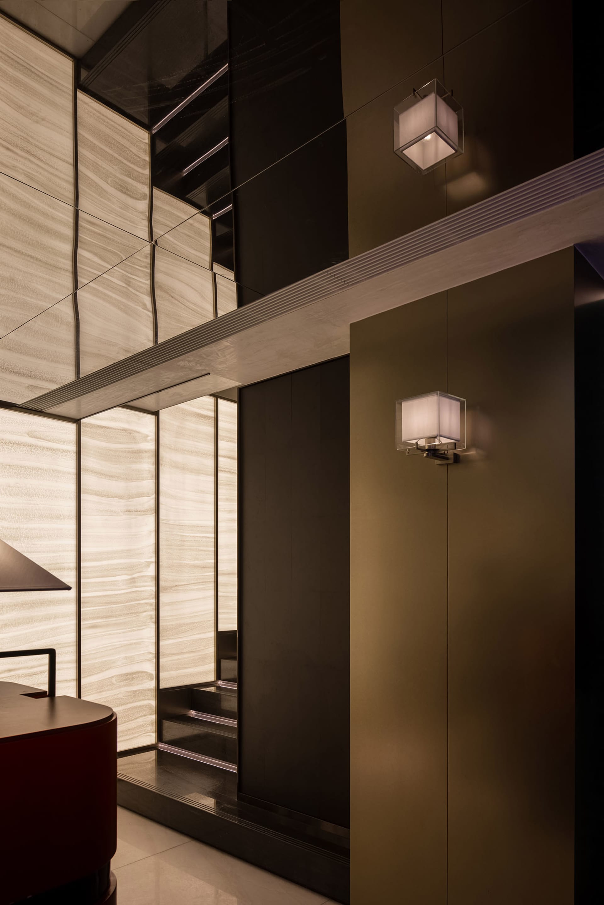 Modern kitchen with dual sinks, a dining table, and well-lit atmosphere