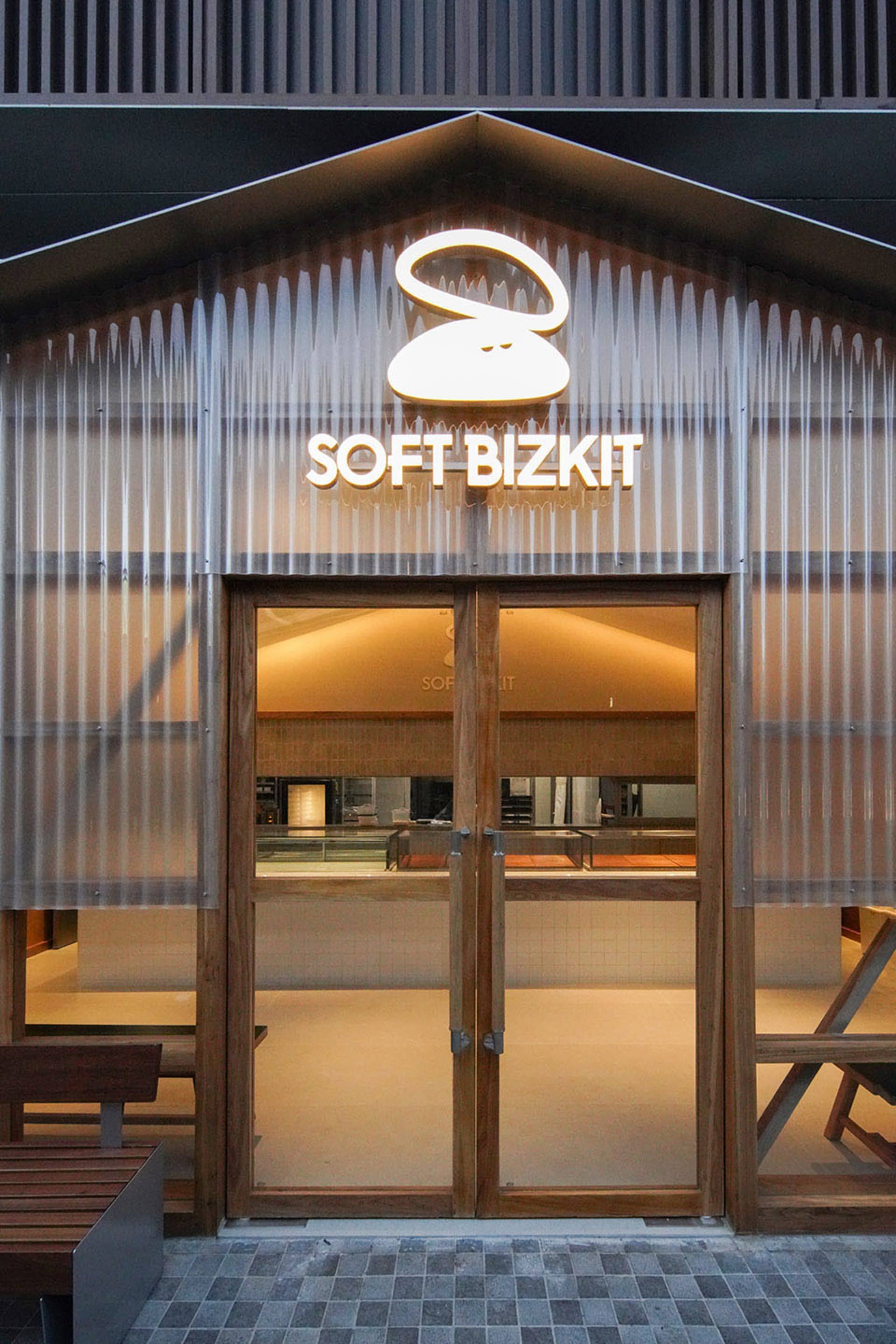 Casual restaurant interior with two empty dining tables, wooden floor, and inviting atmosphere