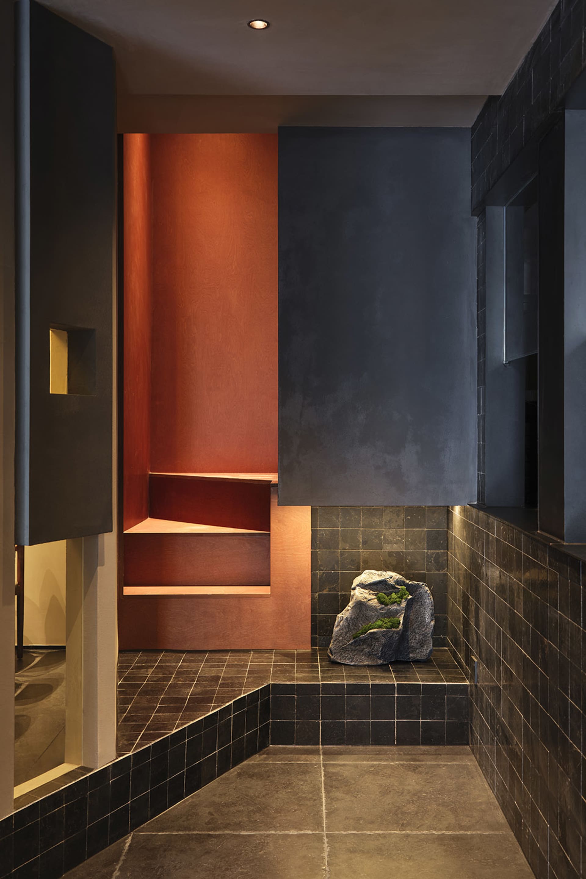 Bathroom with a black stone tile floor, modern fixtures, and a clean aesthetic
