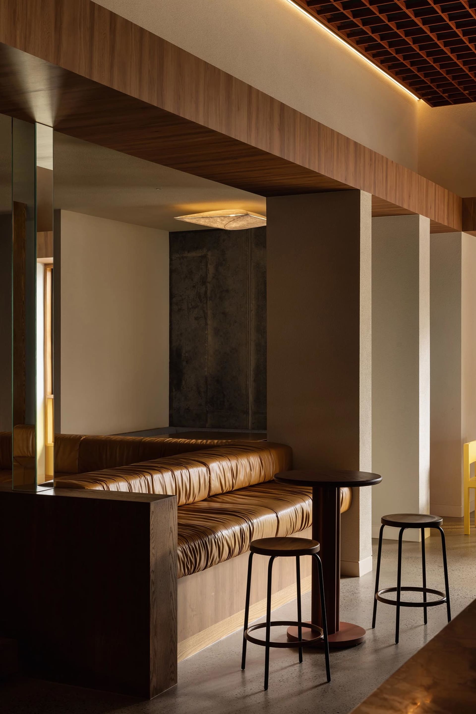 Cozy living space with a large couch, two chairs, a dining table, and leather furniture, creating a luxurious atmosphere