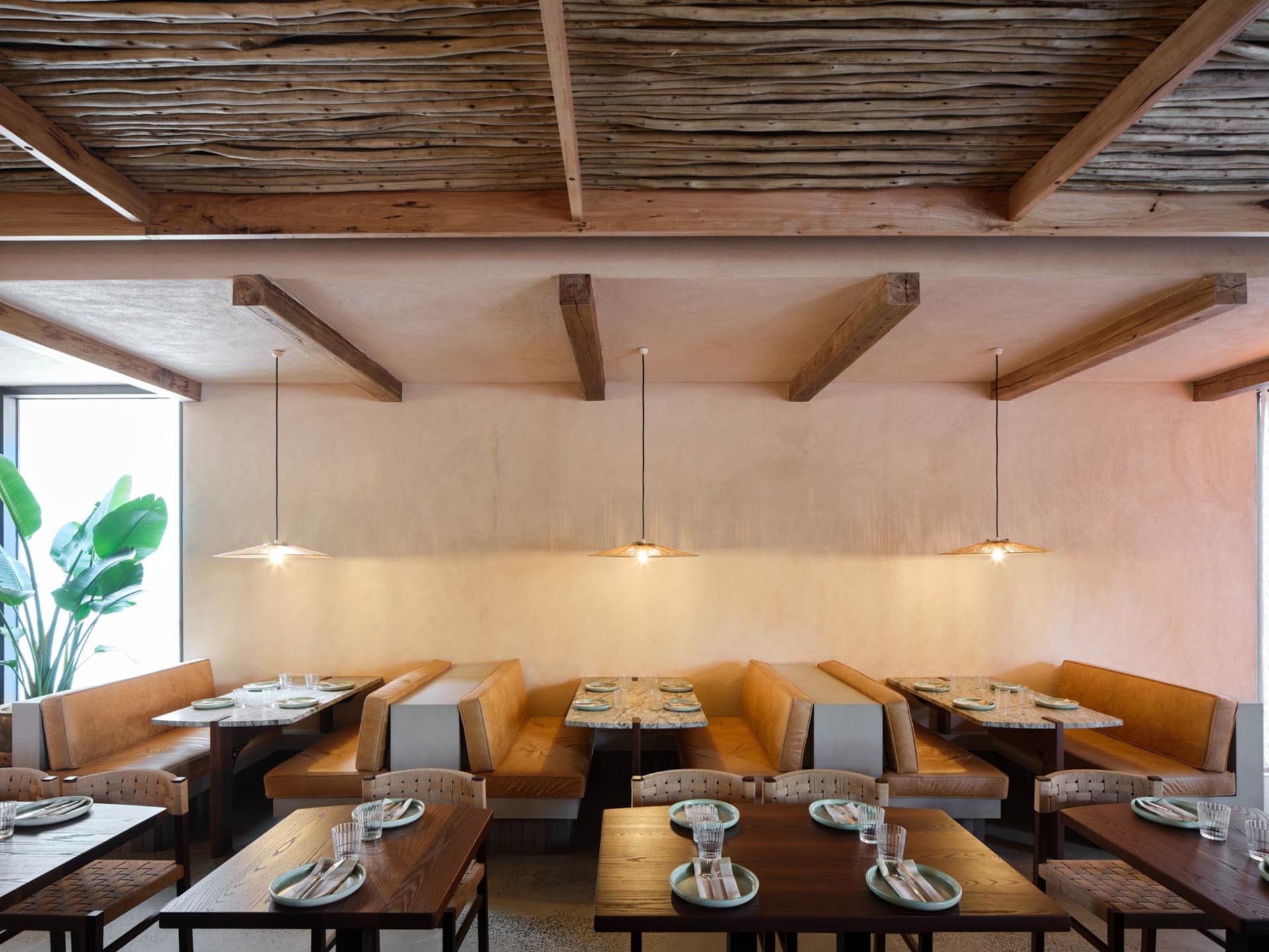 Warm and inviting restaurant interior with wooden tables and chairs, rustic charm, and a focus on comfort and functionality
