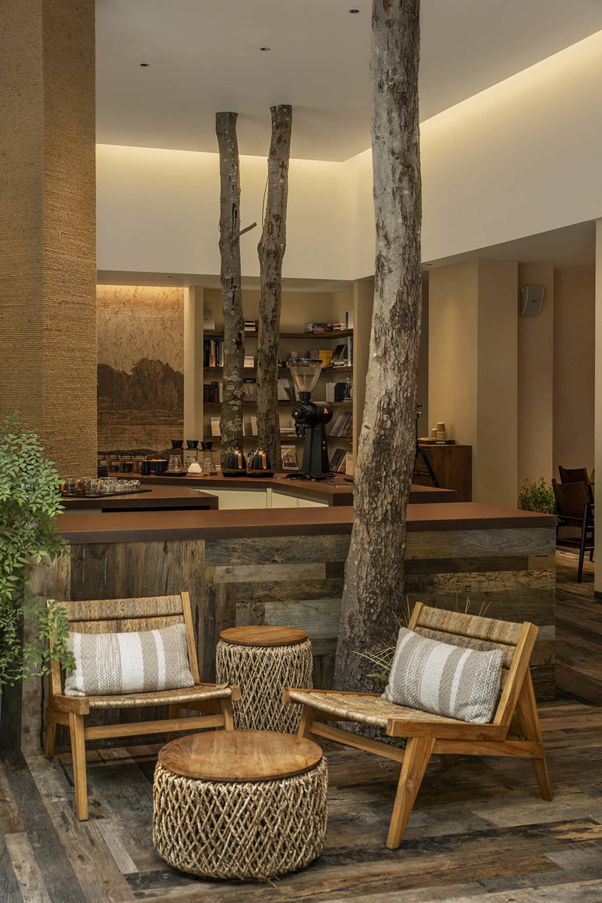 Cozy living area with wooden furniture, comfortable seating, and decorative elements, featuring a modern design with natural materials