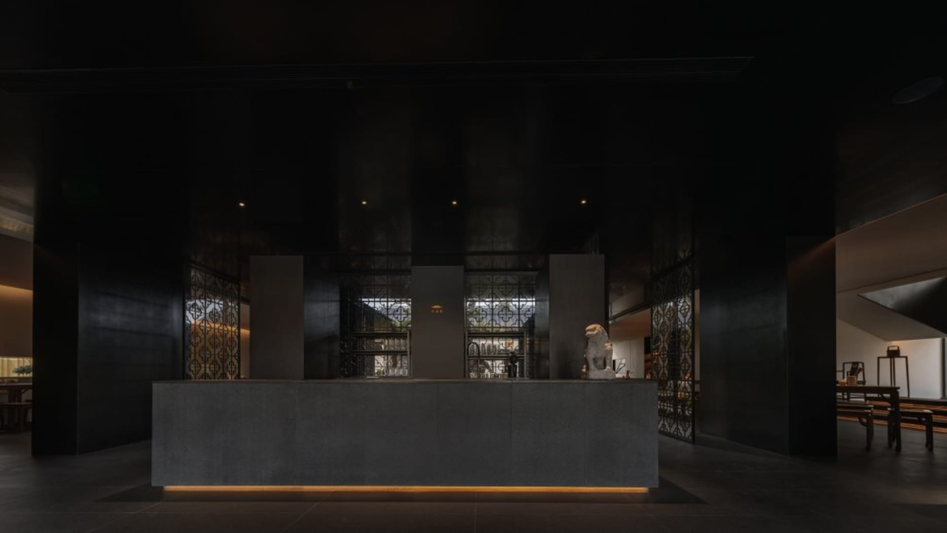 Professional hotel lobby with a reception desk, counter, and guests, featuring a welcoming atmosphere