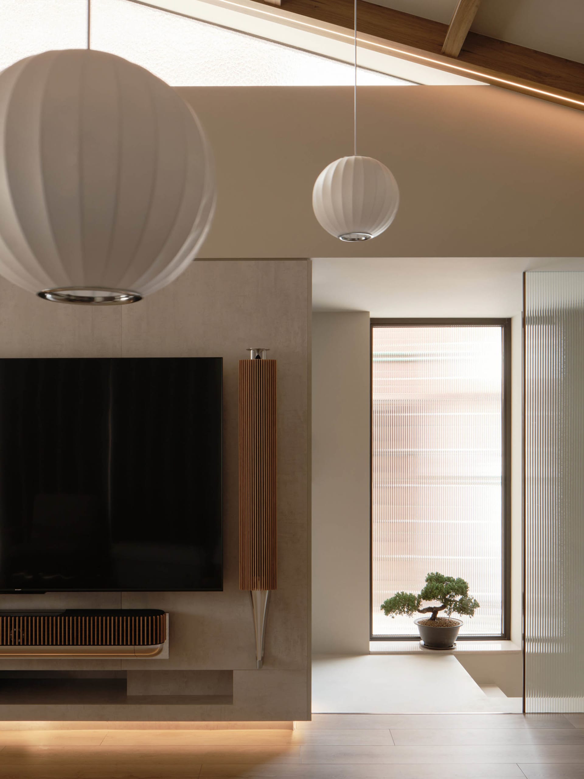 Cozy living space with a flat screen TV above a fireplace, white lamps, and a potted plant adding a touch of greenery
