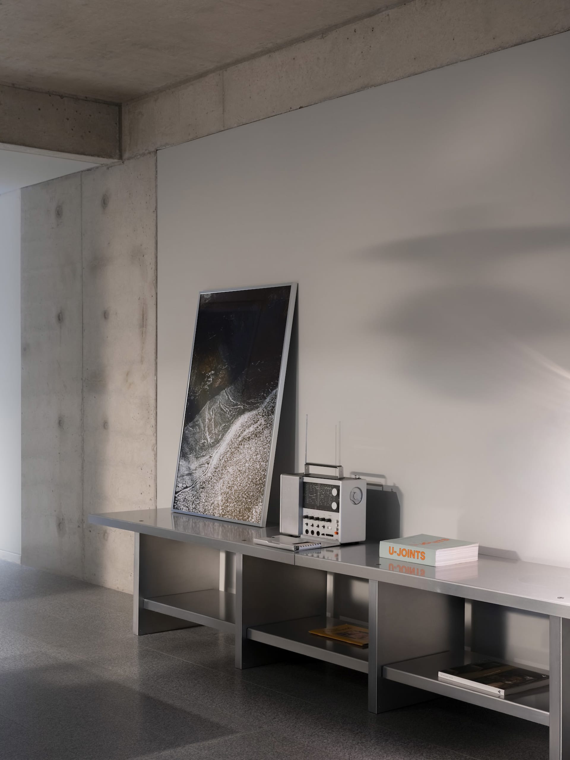 An organized office space with a desk, clocks, and various items, conveying a sense of productivity and functionality