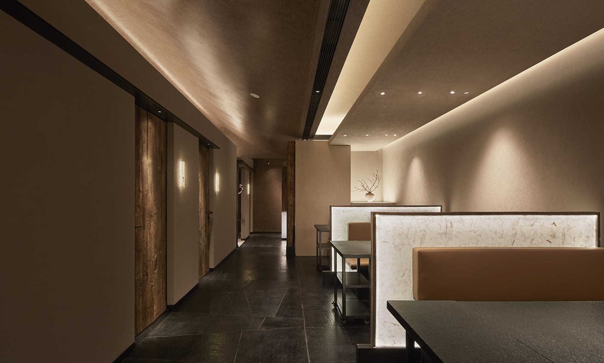 Spacious restaurant interior with modern design, well-lit and functional dining area with rows of tables and chairs