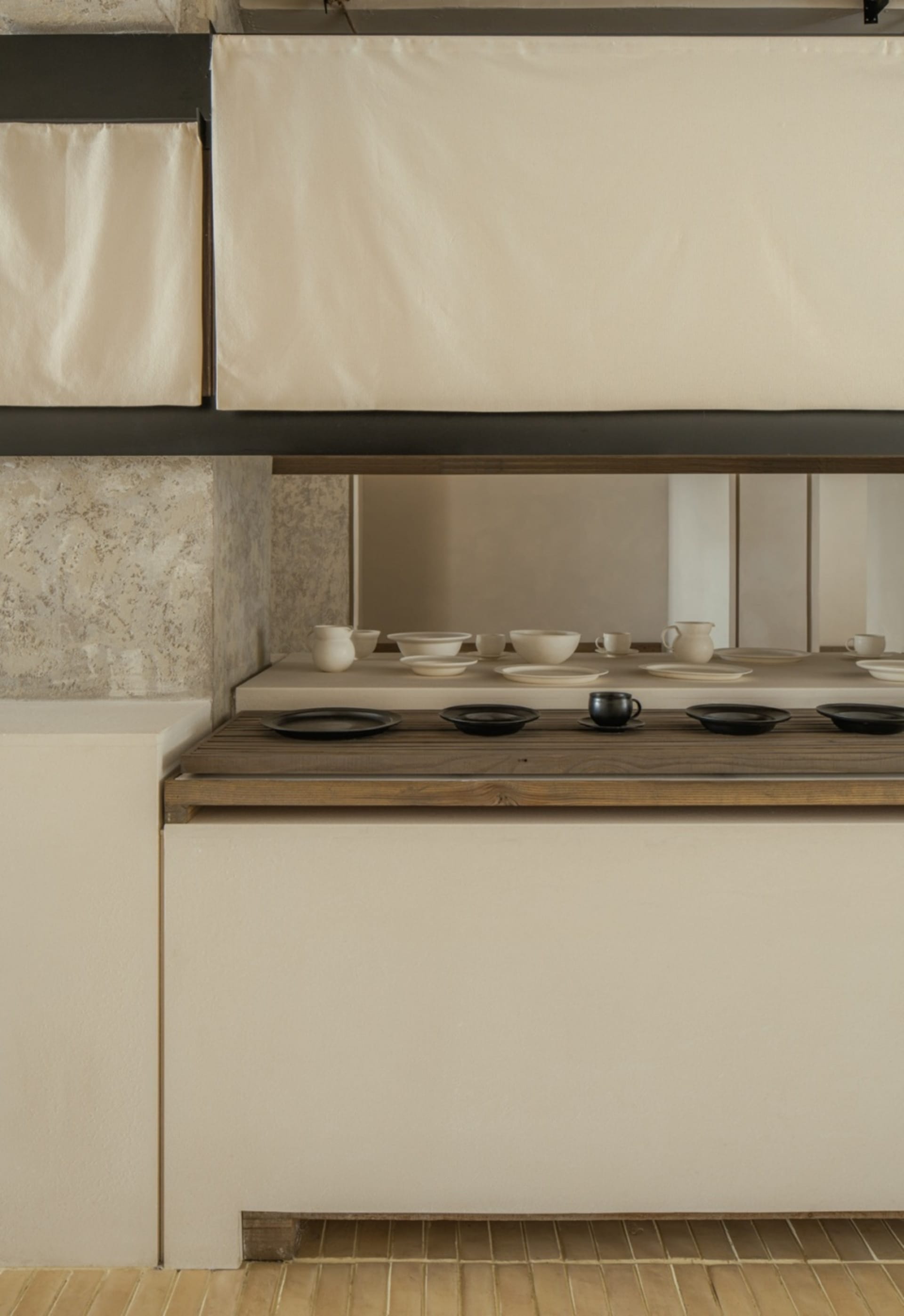 A clean and organized kitchen counter with various bowls of different sizes placed on its surface