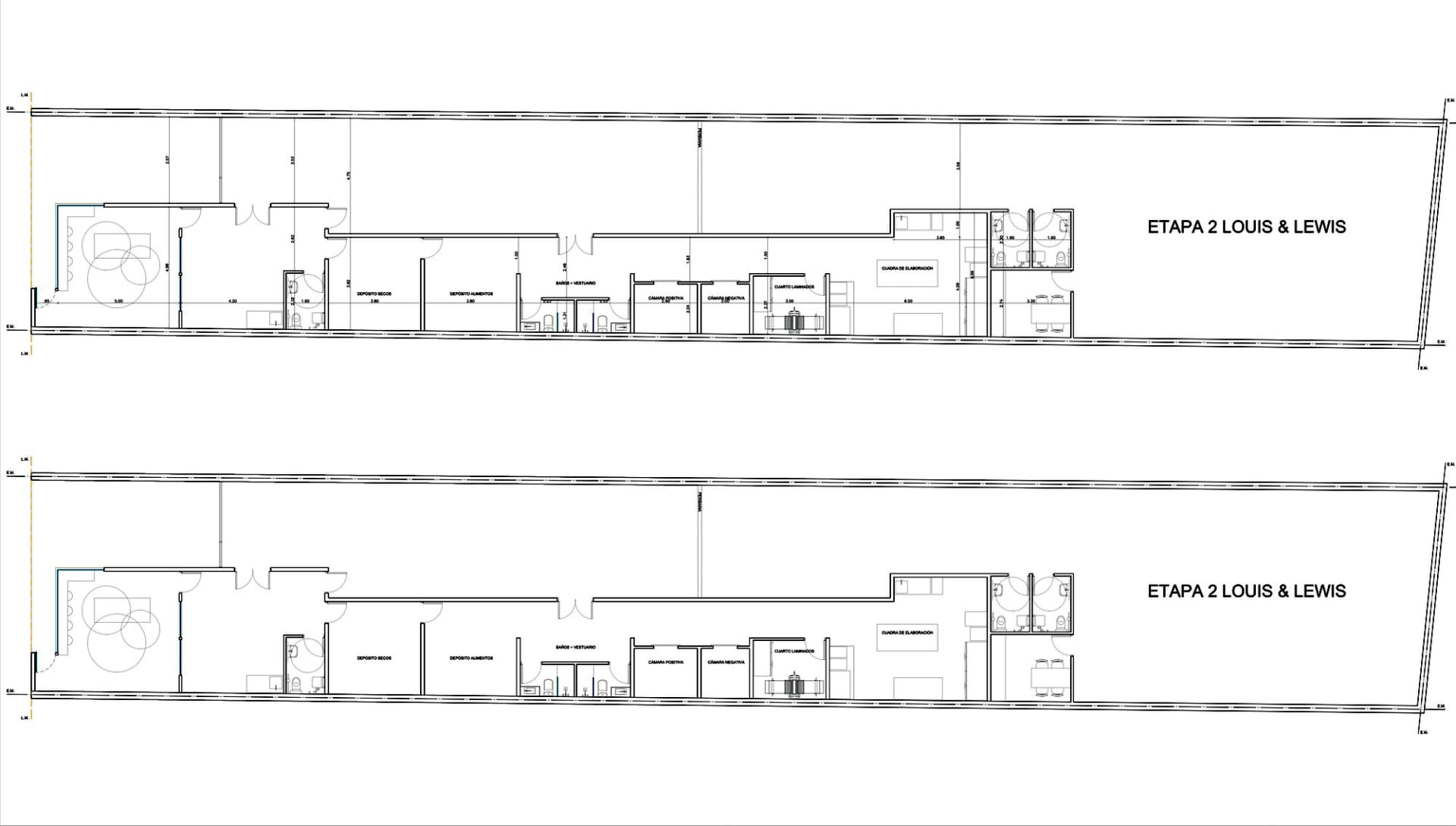 A large, open industrial space with white walls, no furniture, and a clean, bright appearance