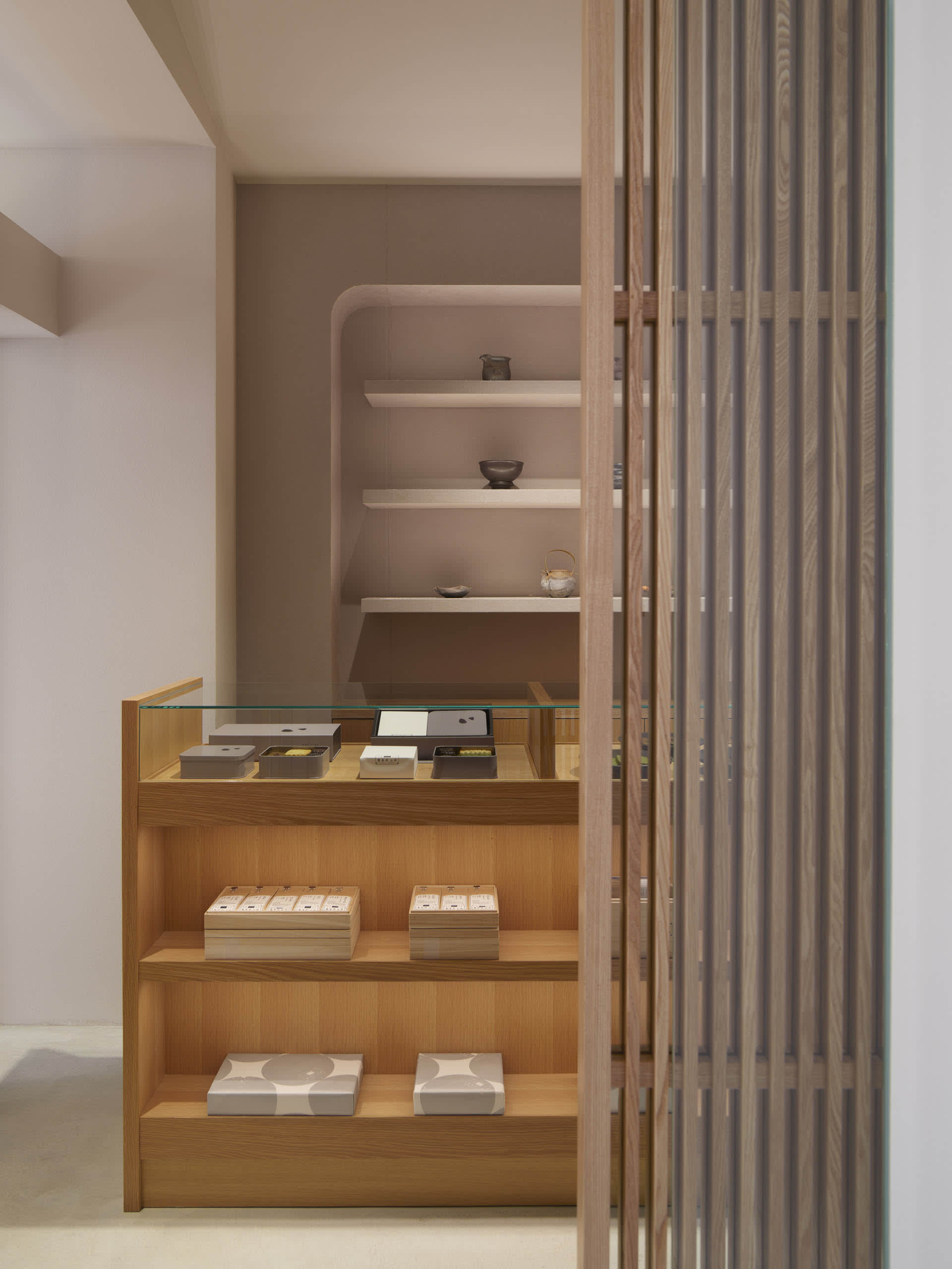 A well-organized retail store with bowls, cups, and books on display, creating an inviting atmosphere for customers