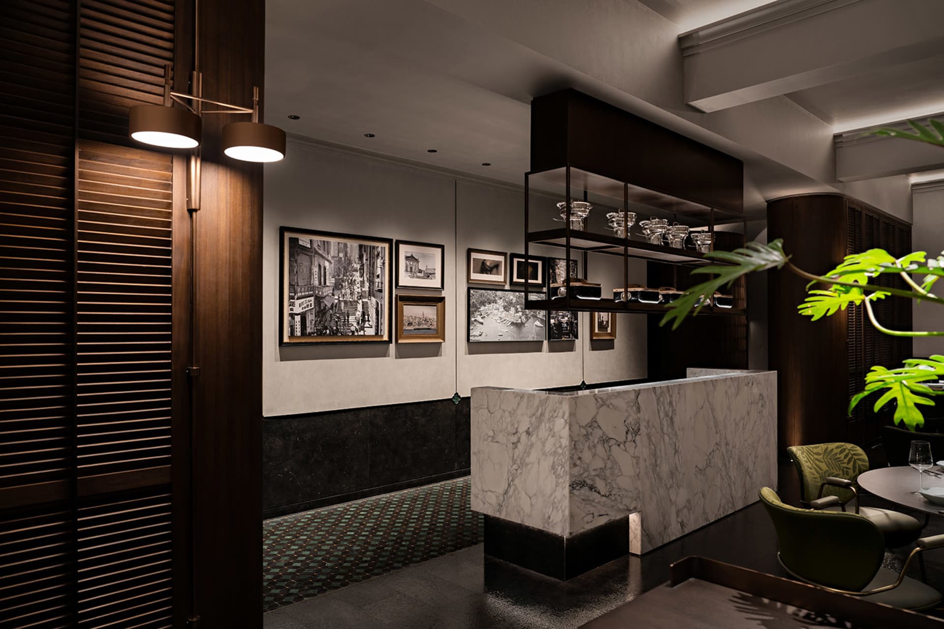 Modern restaurant interior with marble countertop, decorative items, and warm lighting