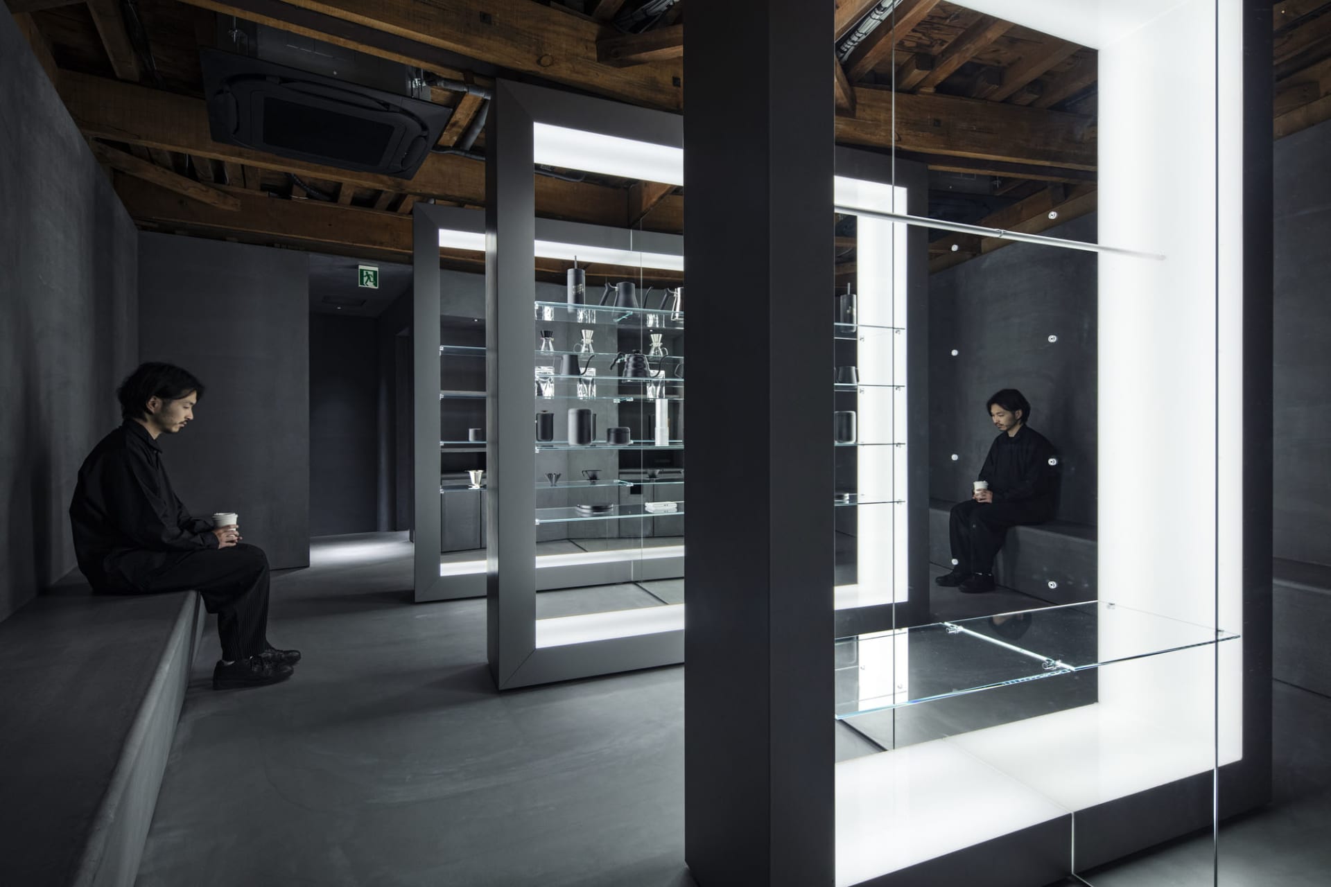 A casual bathroom with a mirror, bench, and cups, reflecting a relaxed atmosphere
