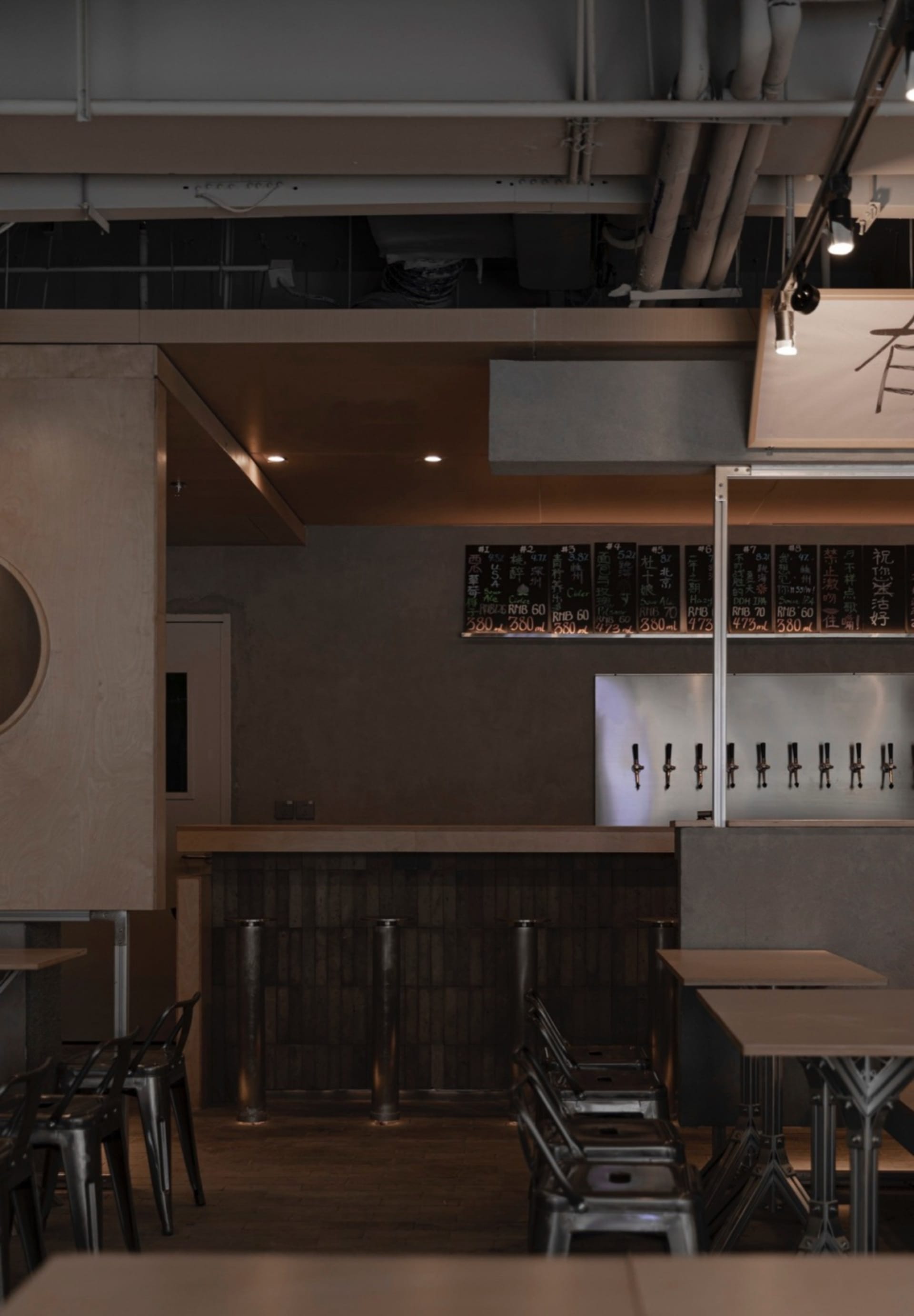 Modern Asian restaurant with a bar area, dining space, and decorative bottles, set in a welcoming atmosphere
